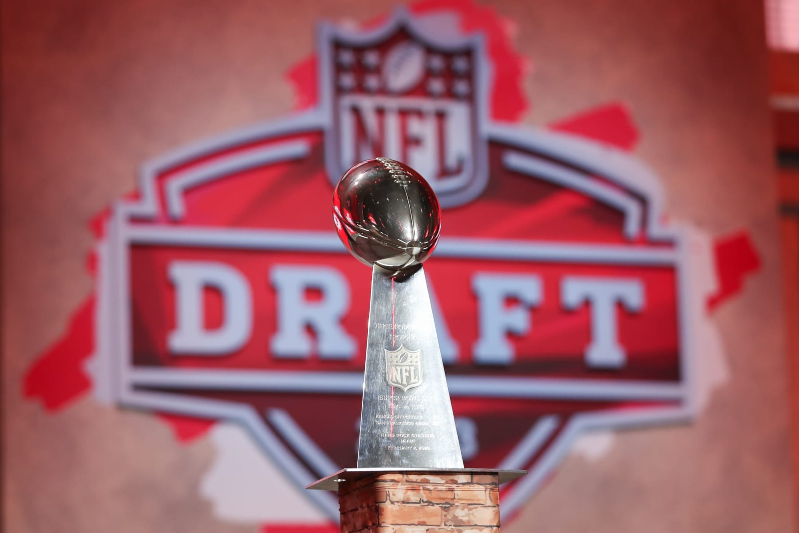 KANSAS CITY, MO - APRIL 27: A view of a Kansas City Chiefs Lombardi Trophy with the NFL Draft logo in the background during first round of the NFL Draft Red Carpet event on April 27, 2023 at Union Station in Kansas City, MO. (Photo by Scott Winters/Icon Sportswire via Getty Images) KANSAS CITY, MO - APRIL 27: A view of a Kansas City Chiefs Lombardi Trophy with the NFL Draft logo in the background during first round of the NFL Draft Red Carpet event on April 27, 2023 at Union Station in Kansas City, MO. (Photo by Scott Winters/Icon Sportswire via Getty Images)