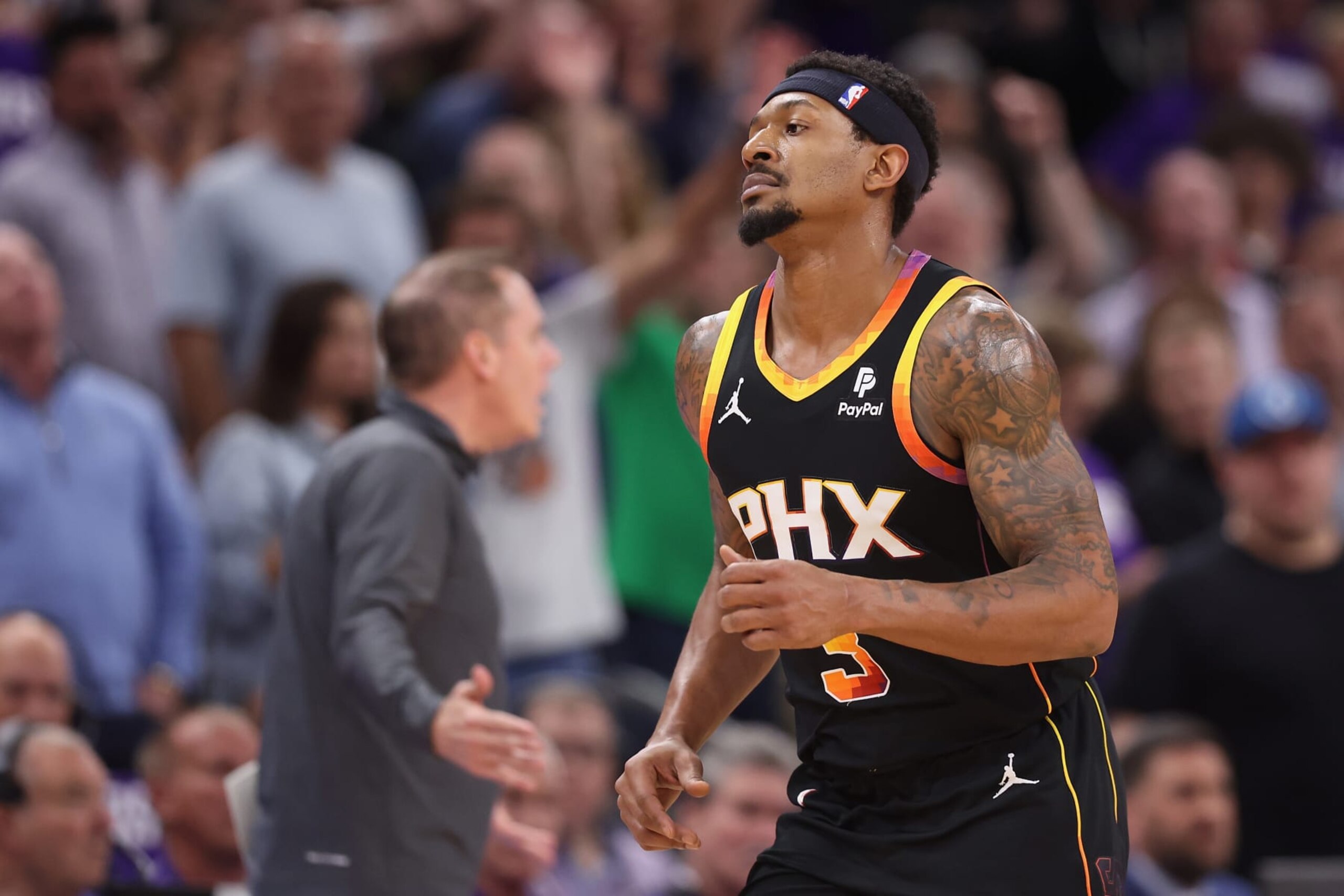 PHOENIX, ARIZONA - APRIL 28: Bradley Beal #3 of the Phoenix Suns runs past head coach Frank Vogel during the second half of game four of the Western Conference First Round Playoffs at Footprint Center on April 28, 2024 in Phoenix, Arizona. The Timberwolves defeated the Suns 122-116 and win the series 4-0.  NOTE TO USER: User expressly acknowledges and agrees that, by downloading and or using this photograph, User is consenting to the terms and conditions of the Getty Images License Agreement.  (Photo by Christian Petersen/Getty Images)