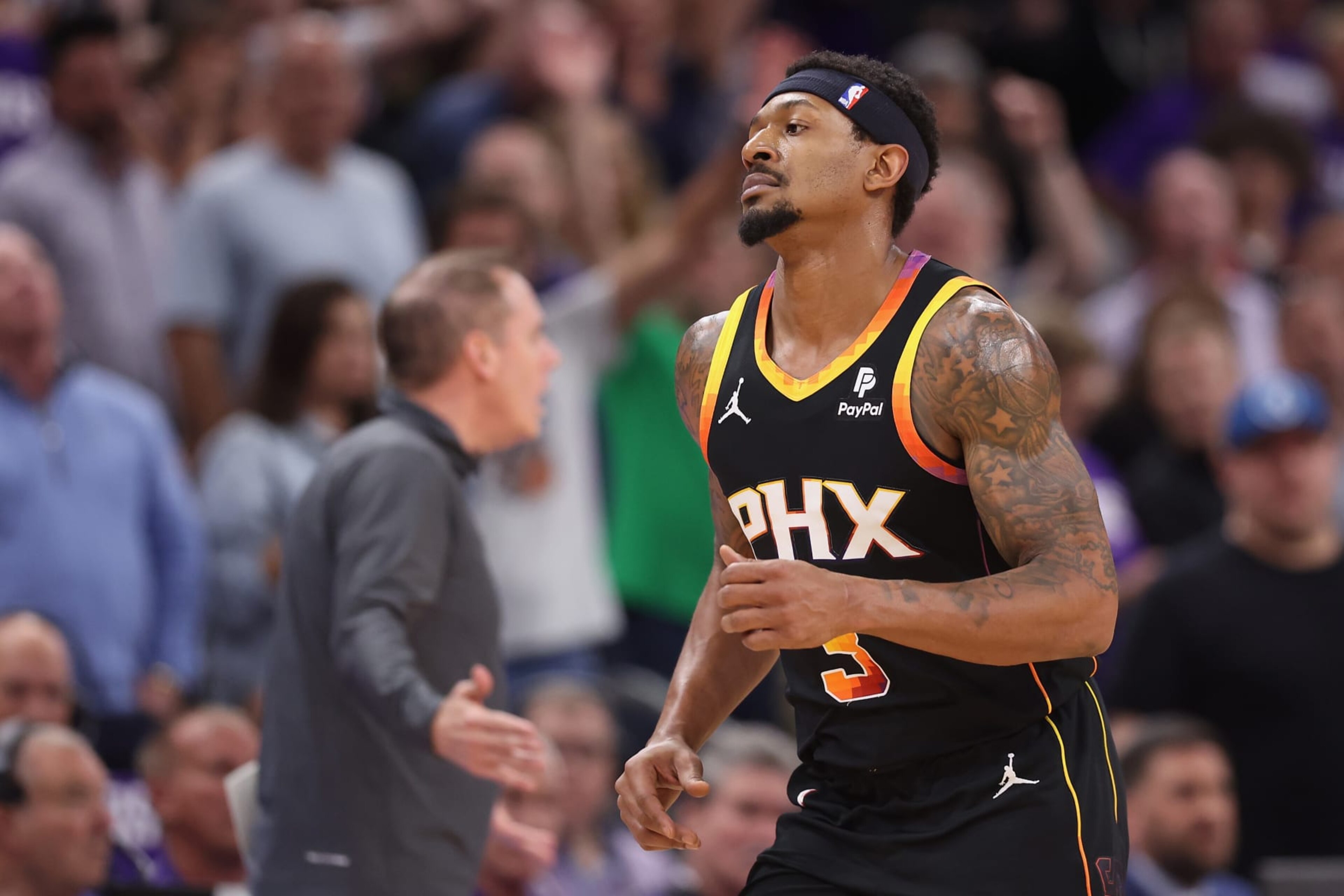 PHOENIX, ARIZONA - APRIL 28: Bradley Beal #3 of the Phoenix Suns runs past head coach Frank Vogel during the second half of game four of the Western Conference First Round Playoffs at Footprint Center on April 28, 2024 in Phoenix, Arizona. The Timberwolves defeated the Suns 122-116 and win the series 4-0.  NOTE TO USER: User expressly acknowledges and agrees that, by downloading and or using this photograph, User is consenting to the terms and conditions of the Getty Images License Agreement.  (Photo by Christian Petersen/Getty Images)