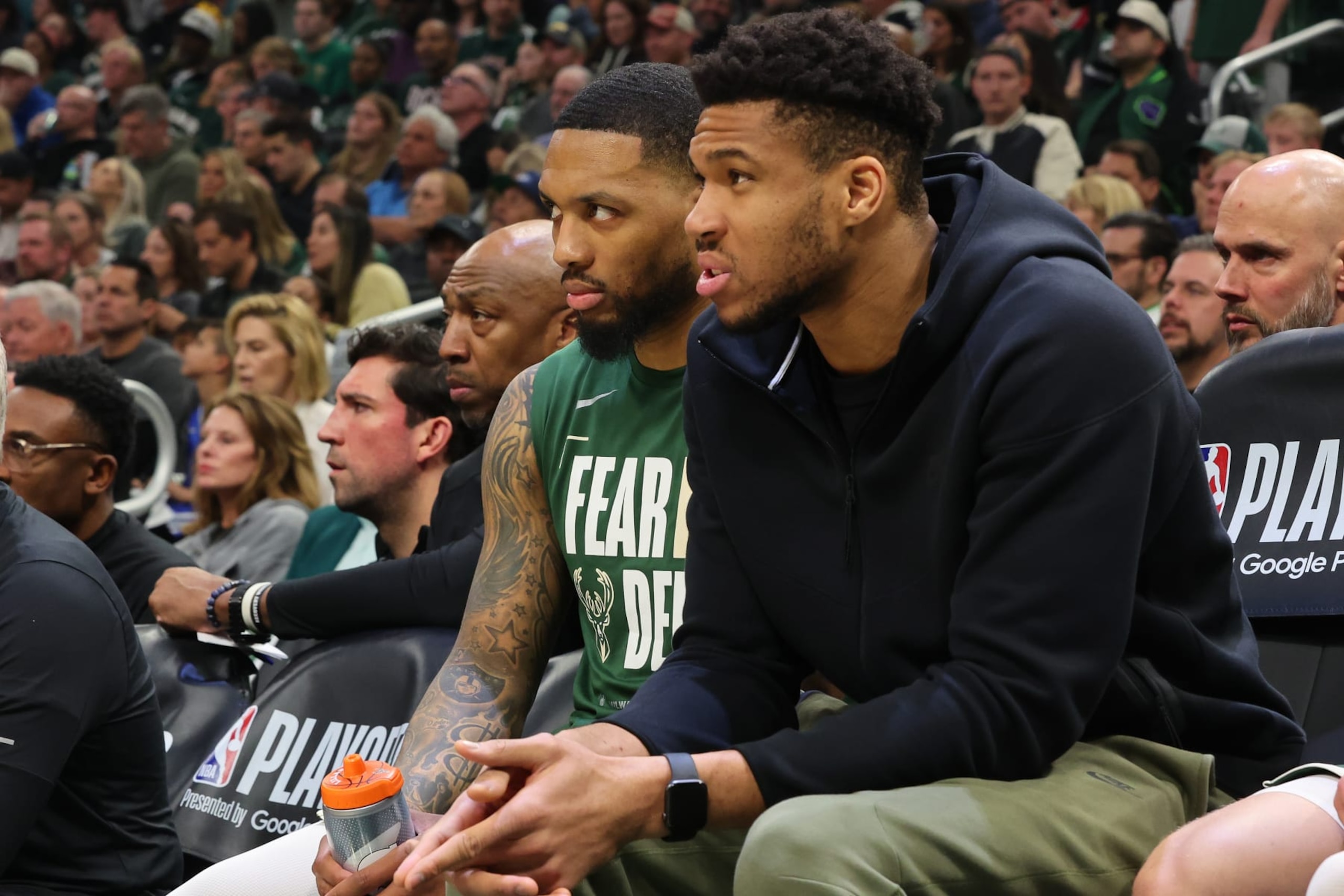 MILWAUKEE, WISCONSIN - APRIL 21: Damian Lillard #0 and Giannis Antetokounmpo #34 of the Milwaukee Bucks watch action during the first half of game one of the Eastern Conference First Round Playoffs against the Indiana Pacers at Fiserv Forum on April 21, 2024 in Milwaukee, Wisconsin.  NOTE TO USER: User expressly acknowledges and agrees that, by downloading and or using this photograph, User is consenting to the terms and conditions of the Getty Images License Agreement. (Photo by Stacy Revere/Getty Images)