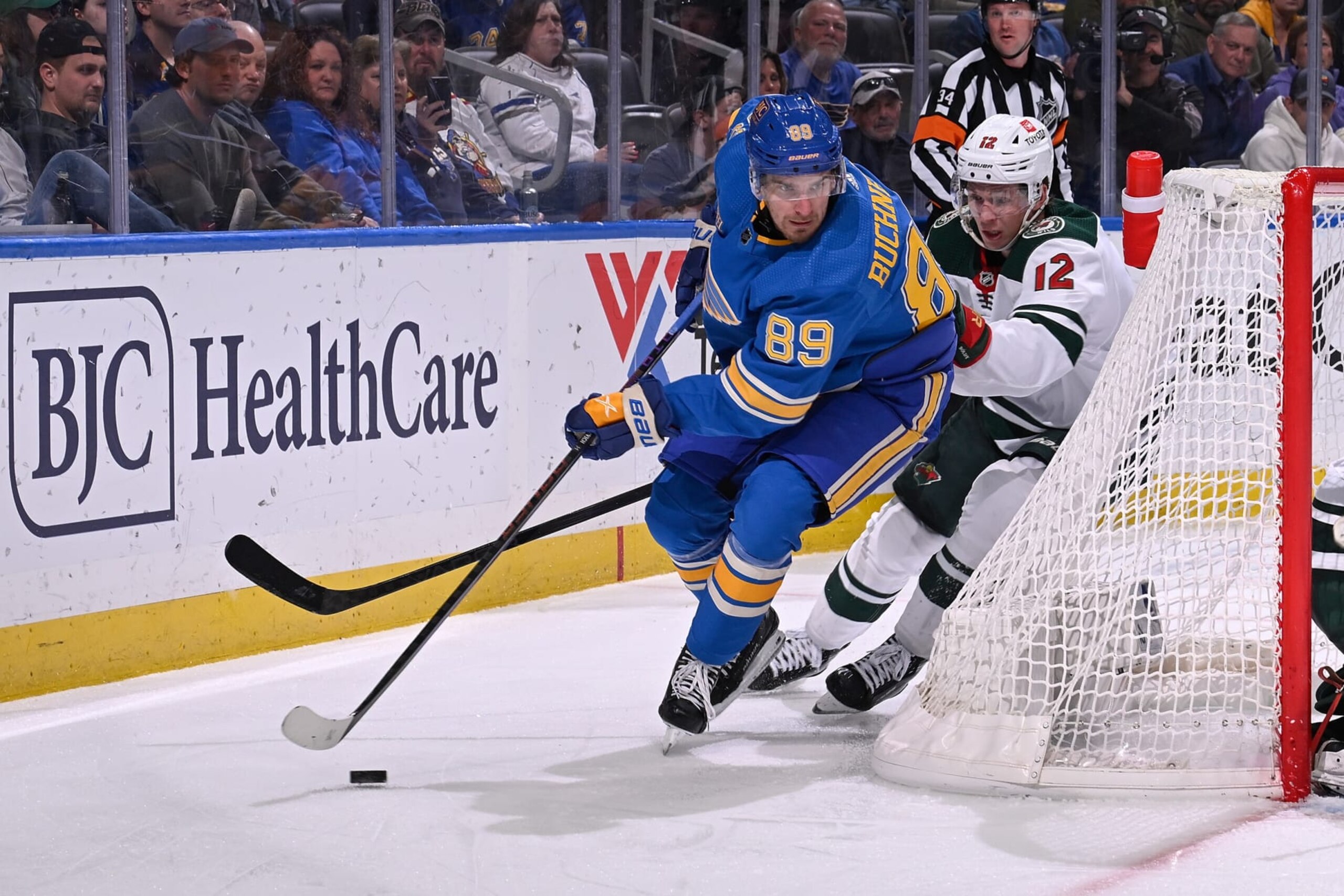 ST. LOUIS, MO - MARCH 16: Matt Boldy #12 of the Minnesota Wild pressures Pavel Buchnevich #89 of the St. Louis Blues on March 16, 2024 at the Enterprise Center in St. Louis, Missouri. (Photo by Joe Puetz/NHLI via Getty Images)