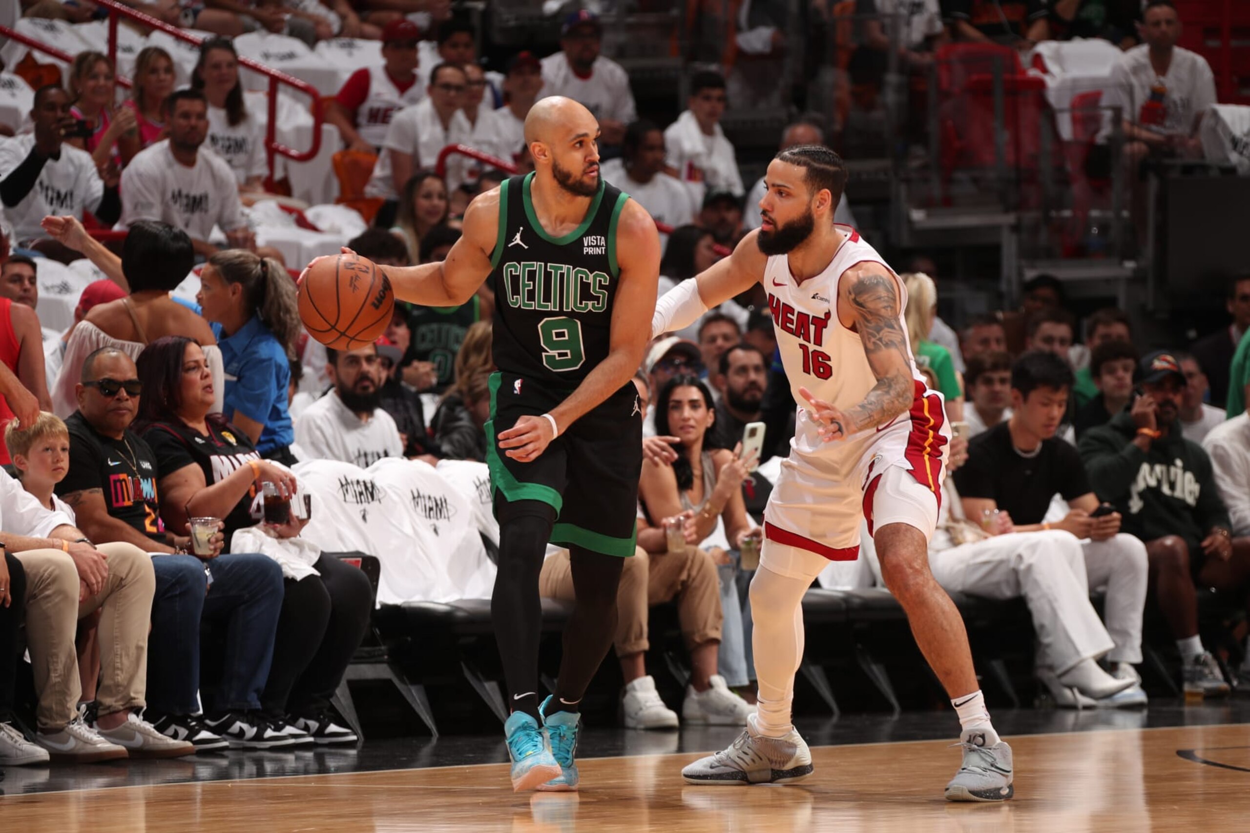 MIAMI, FL - APRIL 27: Derrick White #9 of the Boston Celtics handles the ball against Caleb Martin #16 of the Miami Heat during the game during Round 1 Game 3 of the 2024 NBA Playoffs on April 27, 2024 at Kaseya Center in Miami, Florida. NOTE TO USER: User expressly acknowledges and agrees that, by downloading and or using this Photograph, user is consenting to the terms and conditions of the Getty Images License Agreement. Mandatory Copyright Notice: Copyright 2024 NBAE (Photo by Issac Baldizon/NBAE via Getty Images)