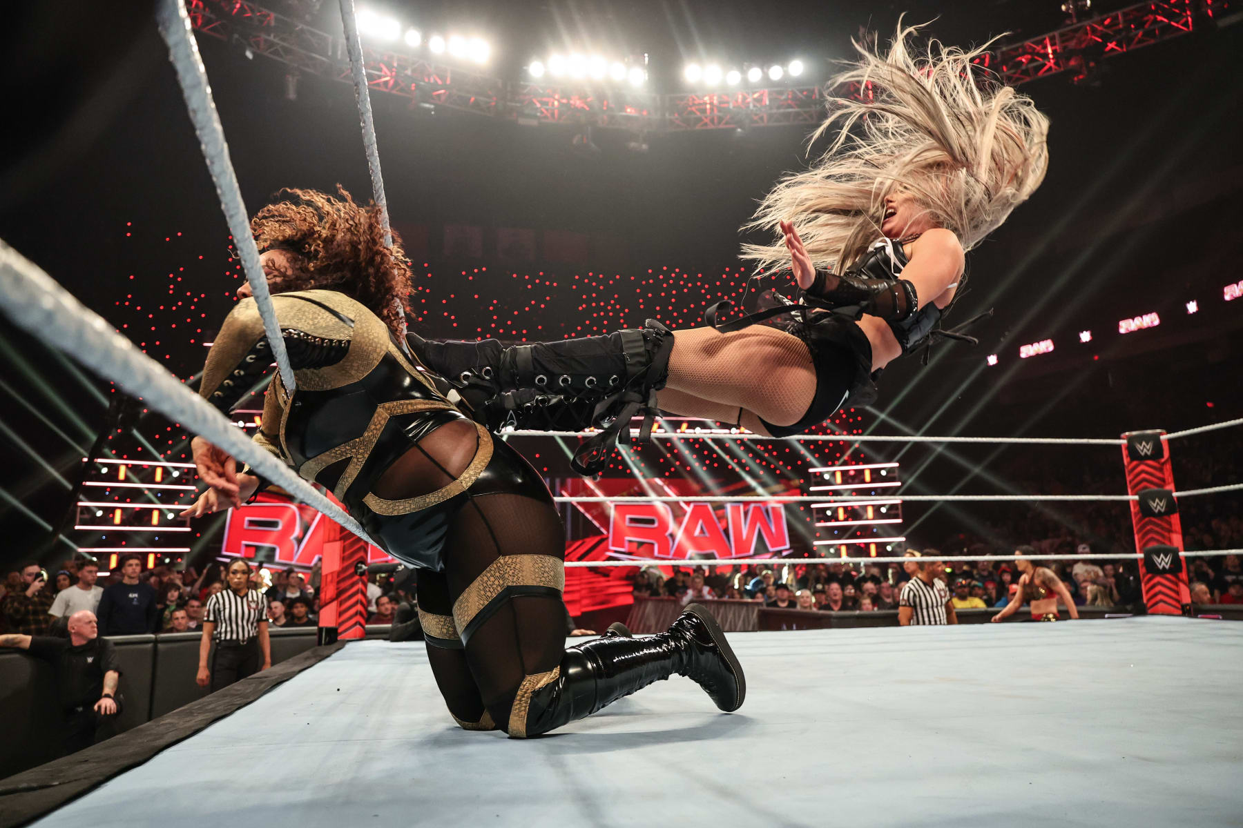 COLUMBUS, OHIO - APRIL 22: Liv Morgan dropkicking Nia Jax against the ropes during Monday Night RAW at Jerome Schottenstein Center on April 22, 2024 in Columbus, Ohio.  (Photo by WWE/Getty Images)