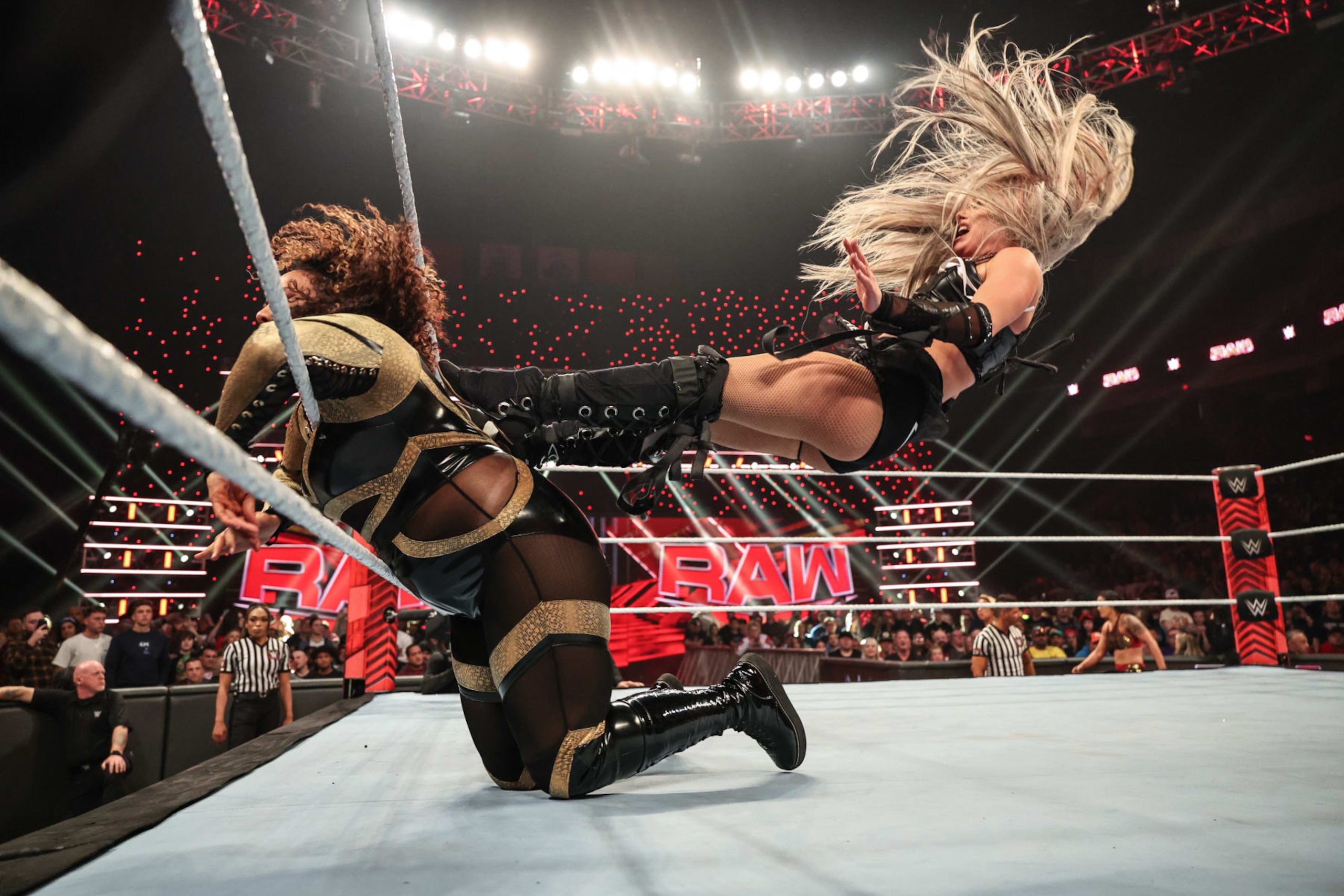 COLUMBUS, OHIO - APRIL 22: Liv Morgan dropkicking Nia Jax against the ropes during Monday Night RAW at Jerome Schottenstein Center on April 22, 2024 in Columbus, Ohio.  (Photo by WWE/Getty Images)