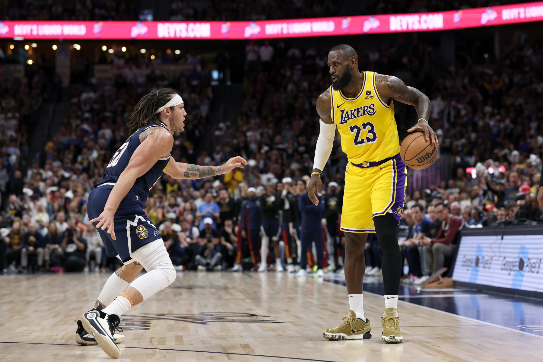 DENVER, COLORADO - APRIL 29: Aaron Gordon #50 of the Denver Nuggets guards LeBron James #23 of the Los Angeles Lakers in the third quarter during game five of the Western Conference First Round Playoffs at Ball Arena on April 29, 2024 in Denver, Colorado. NOTE TO USER: User expressly acknowledges and agrees that, by downloading and or using this photograph, User is consenting to the terms and conditions of the Getty Images License Agreement. (Photo by Matthew Stockman/Getty Images) DENVER, COLORADO - APRIL 29: Aaron Gordon #50 of the Denver Nuggets guards LeBron James #23 of the Los Angeles Lakers in the third quarter during game five of the Western Conference First Round Playoffs at Ball Arena on April 29, 2024 in Denver, Colorado. NOTE TO USER: User expressly acknowledges and agrees that, by downloading and or using this photograph, User is consenting to the terms and conditions of the Getty Images License Agreement. (Photo by Matthew Stockman/Getty Images)
