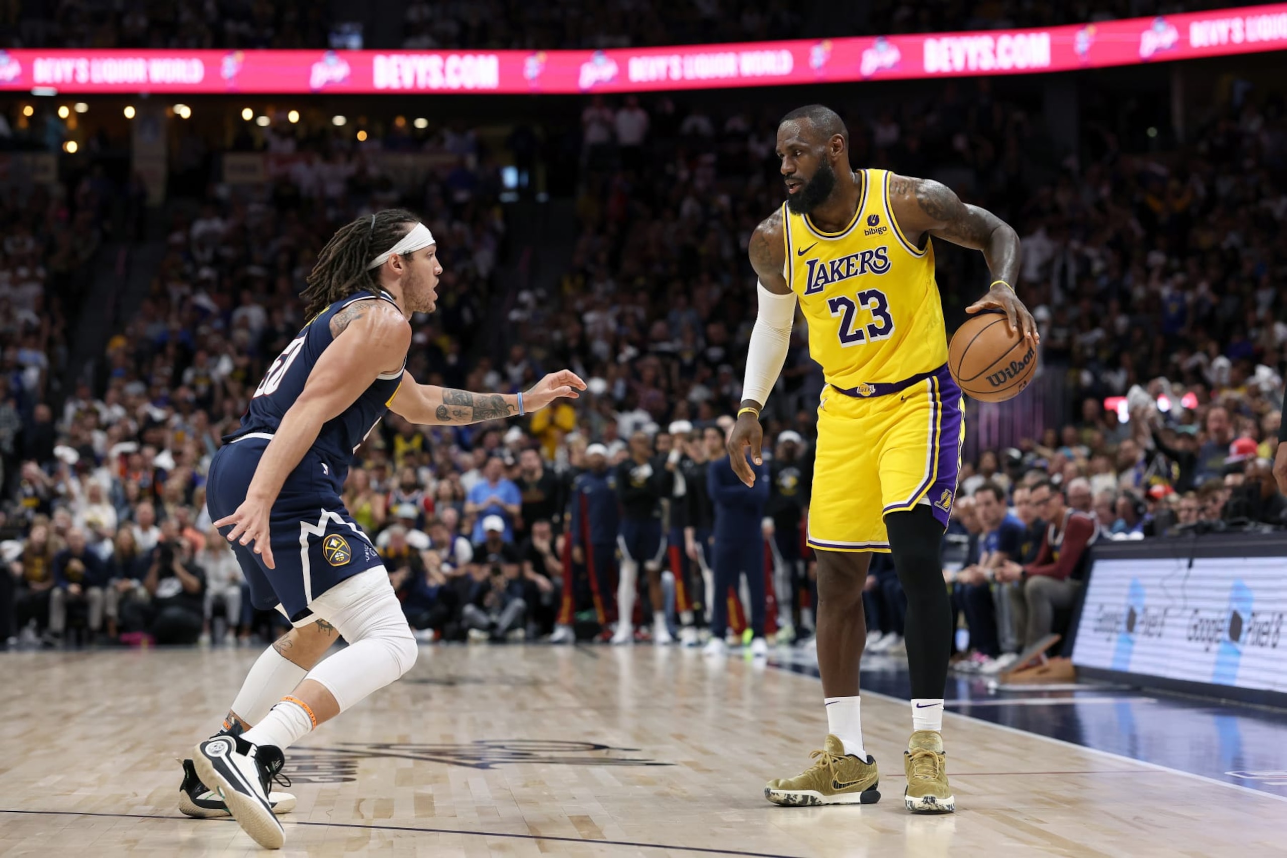 DENVER, COLORADO - APRIL 29: Aaron Gordon #50 of the Denver Nuggets guards LeBron James #23 of the Los Angeles Lakers in the third quarter during game five of the Western Conference First Round Playoffs at Ball Arena on April 29, 2024 in Denver, Colorado. NOTE TO USER: User expressly acknowledges and agrees that, by downloading and or using this photograph, User is consenting to the terms and conditions of the Getty Images License Agreement.  (Photo by Matthew Stockman/Getty Images)