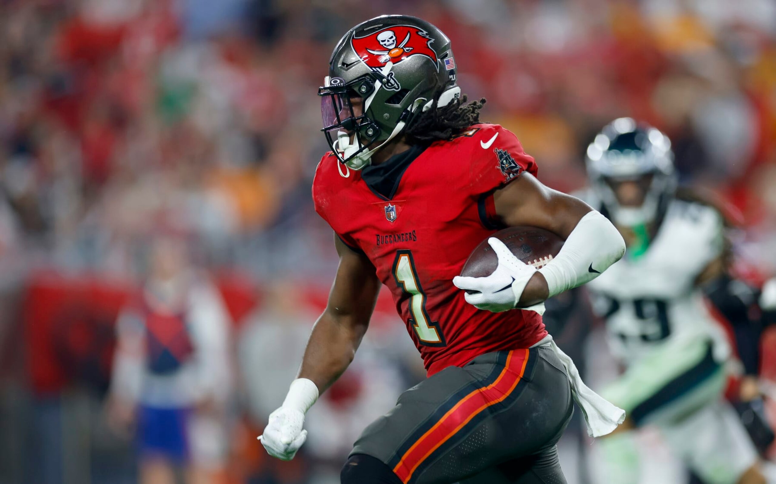 TAMPA, FLORIDA - JANUARY 15: Rachaad White #1 of the Tampa Bay Buccaneers rushes during the NFC Wild Card game against the Philadelphia Eagles at Raymond James Stadium on January 15, 2024 in Tampa, Florida. (Photo by Mike Ehrmann/Getty Images) TAMPA, FLORIDA - JANUARY 15: Rachaad White #1 of the Tampa Bay Buccaneers rushes during the NFC Wild Card game against the Philadelphia Eagles at Raymond James Stadium on January 15, 2024 in Tampa, Florida. (Photo by Mike Ehrmann/Getty Images)