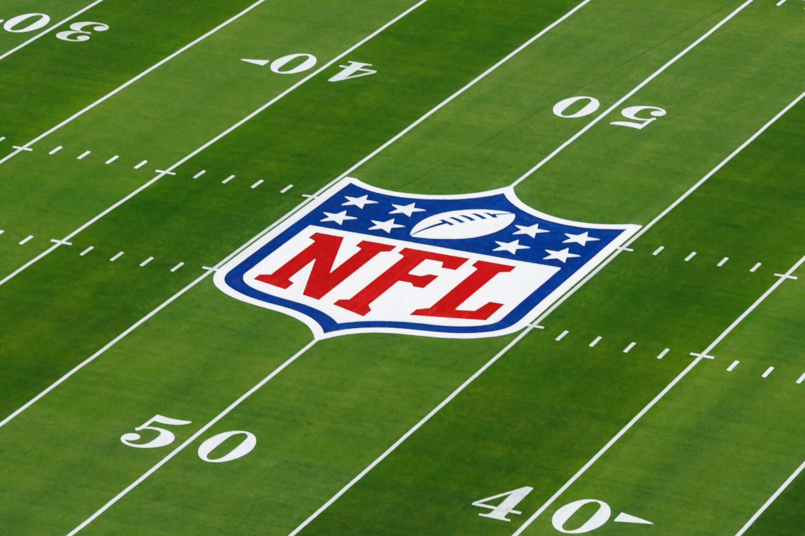 LAS VEGAS, NEVADA - FEBRUARY 11: A detail view of the NFL shield logo painted on the field before Super Bowl LVIII between the Kansas City Chiefs and San Francisco 49ers at Allegiant Stadium on February 11, 2024 in Las Vegas, Nevada. (Photo by Ryan Kang/Getty Images) LAS VEGAS, NEVADA - FEBRUARY 11: A detail view of the NFL shield logo painted on the field before Super Bowl LVIII between the Kansas City Chiefs and San Francisco 49ers at Allegiant Stadium on February 11, 2024 in Las Vegas, Nevada. (Photo by Ryan Kang/Getty Images)