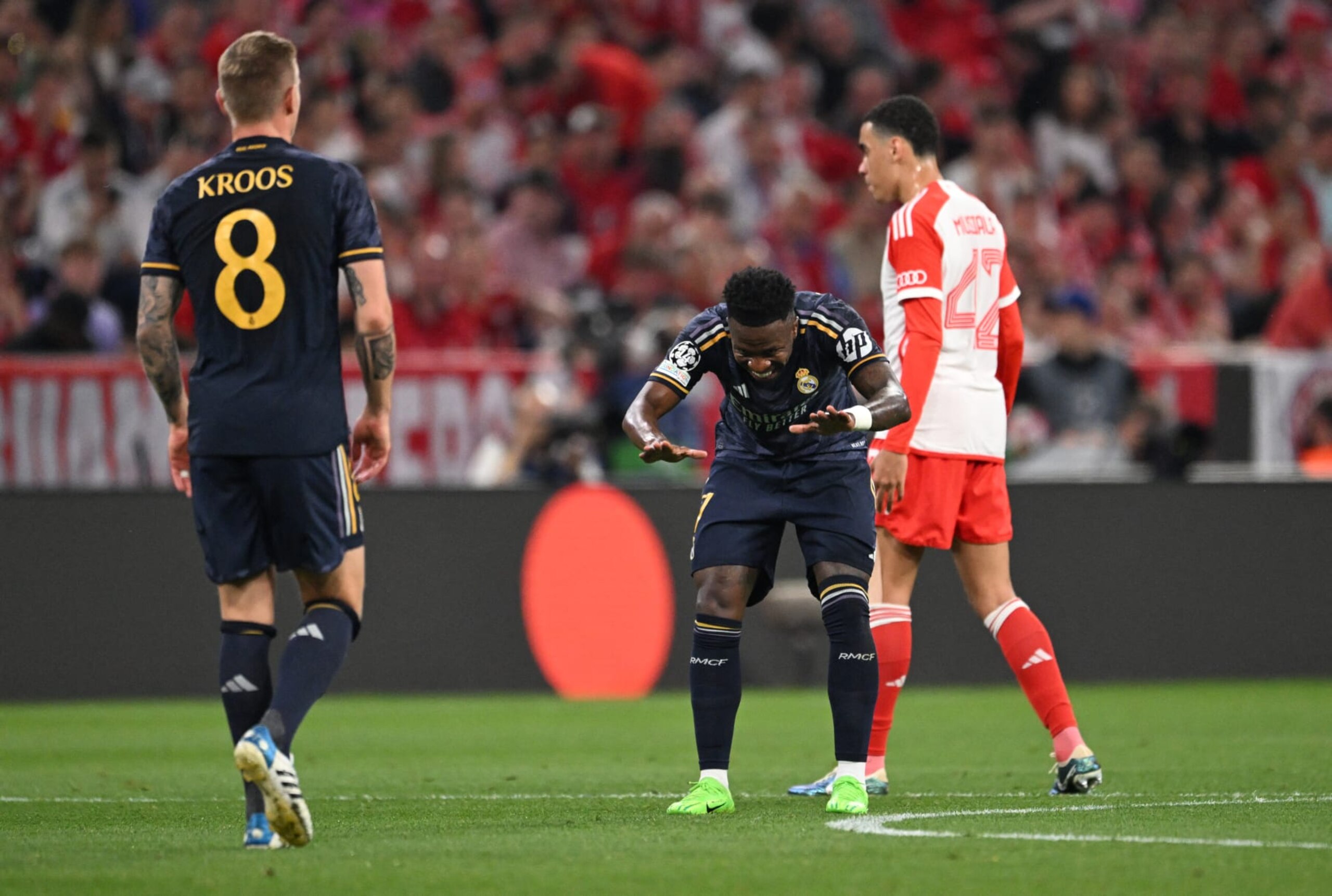 Real Madrid's Brazilian forward #07 Vinicius Junior celebrates with Real Madrid's German midfielder #08 Toni Kroos scoring during the UEFA Champions League semi-final first leg football match between FC Bayern Munich and Real Madrid CF on April 30, 2024 in Munich, southern Germany. (Photo by Kirill KUDRYAVTSEV / AFP) (Photo by KIRILL KUDRYAVTSEV/AFP via Getty Images) Real Madrid's Brazilian forward #07 Vinicius Junior celebrates with Real Madrid's German midfielder #08 Toni Kroos scoring during the UEFA Champions League semi-final first leg football match between FC Bayern Munich and Real Madrid CF on April 30, 2024 in Munich, southern Germany. (Photo by Kirill KUDRYAVTSEV / AFP) (Photo by KIRILL KUDRYAVTSEV/AFP via Getty Images)