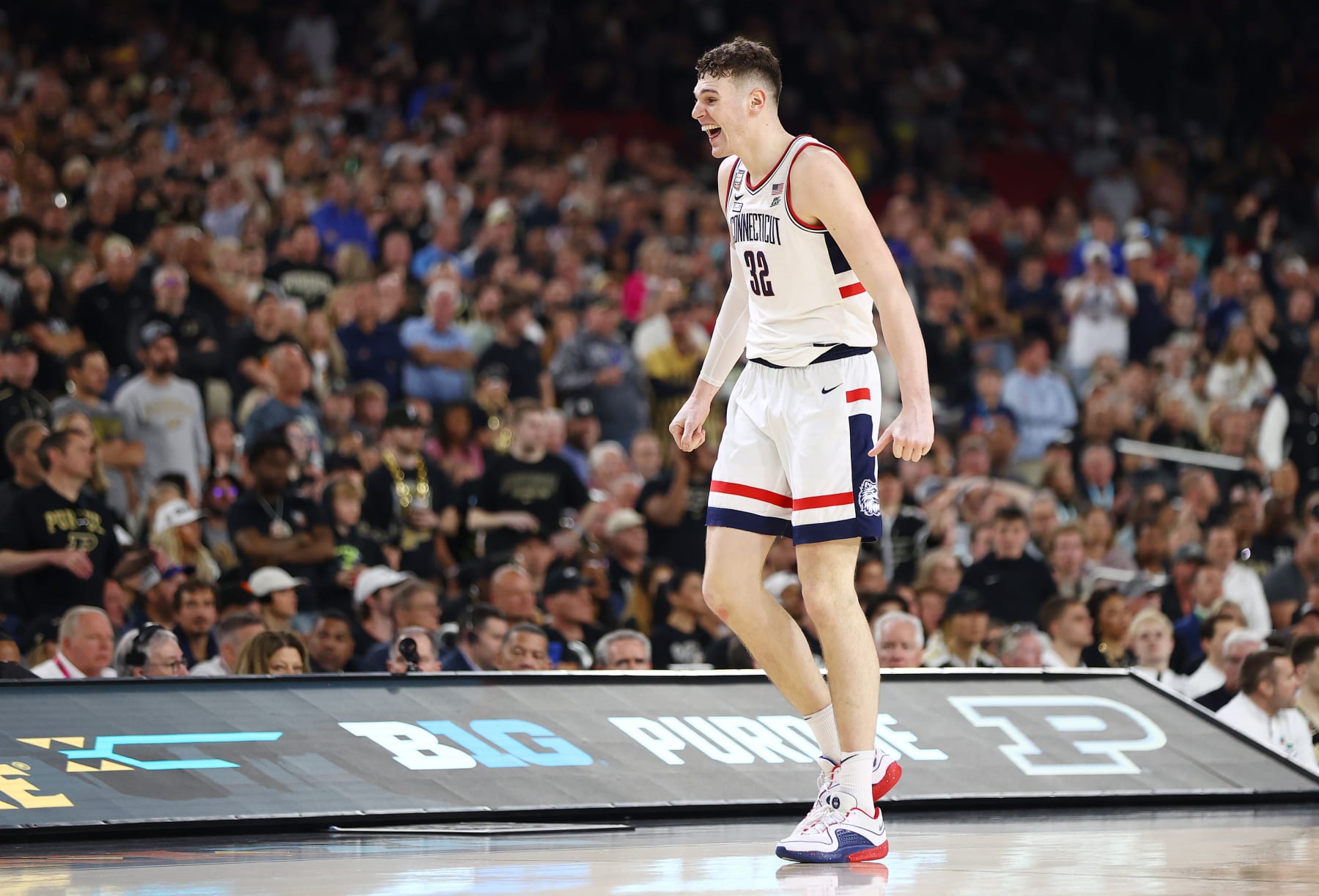 GLENDALE, ARIZONA - APRIL 08: Donovan Clingan #32 of the Connecticut Huskies celebrates during the second half in the NCAA Men's Basketball Tournament National Championship game at State Farm Stadium on April 08, 2024 in Glendale, Arizona. (Photo by Jamie Schwaberow/NCAA Photos via Getty Images)