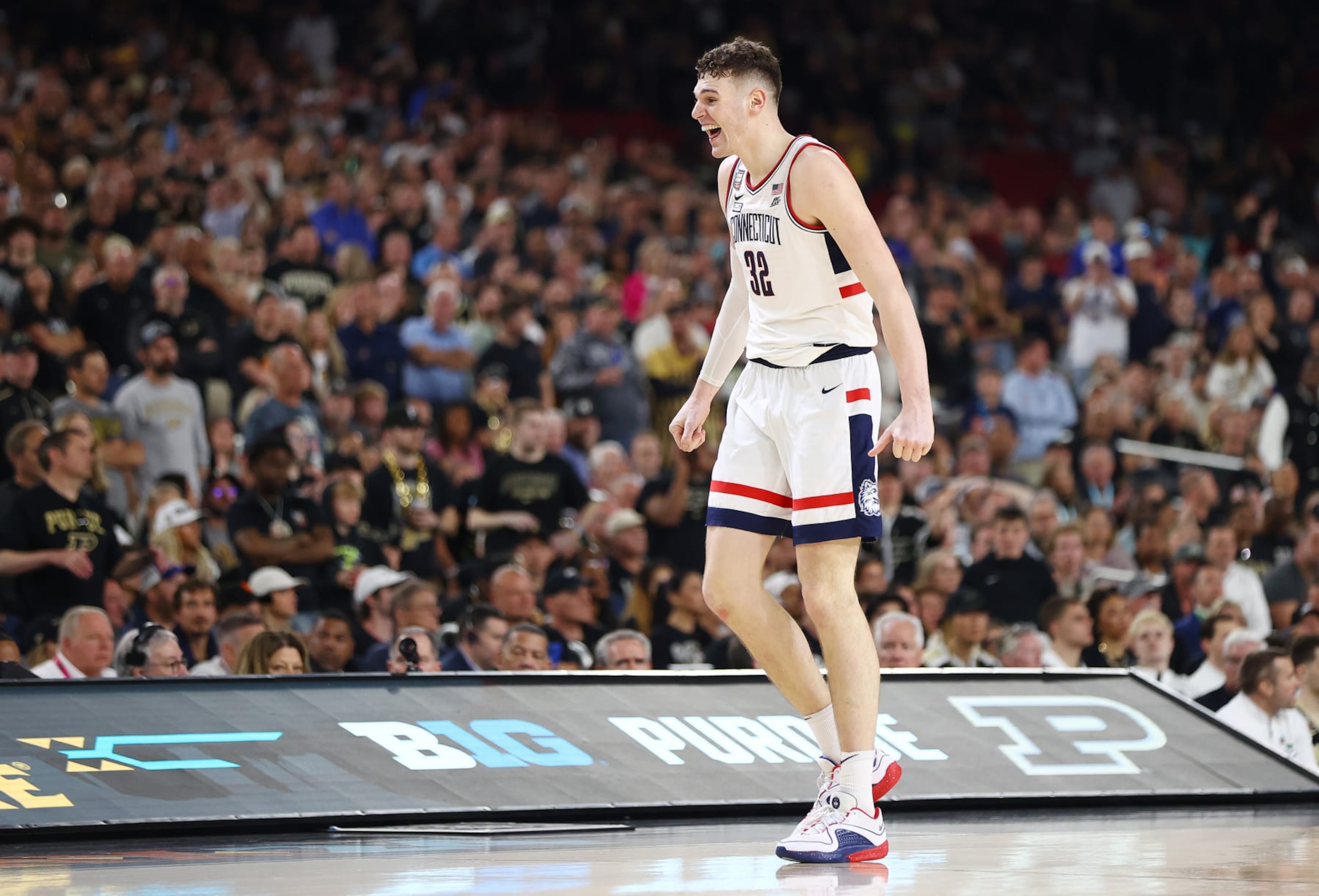 GLENDALE, ARIZONA - APRIL 08: Donovan Clingan #32 of the Connecticut Huskies celebrates during the second half in the NCAA Men's Basketball Tournament National Championship game at State Farm Stadium on April 08, 2024 in Glendale, Arizona. (Photo by Jamie Schwaberow/NCAA Photos via Getty Images) GLENDALE, ARIZONA - APRIL 08: Donovan Clingan #32 of the Connecticut Huskies celebrates during the second half in the NCAA Men's Basketball Tournament National Championship game at State Farm Stadium on April 08, 2024 in Glendale, Arizona. (Photo by Jamie Schwaberow/NCAA Photos via Getty Images)