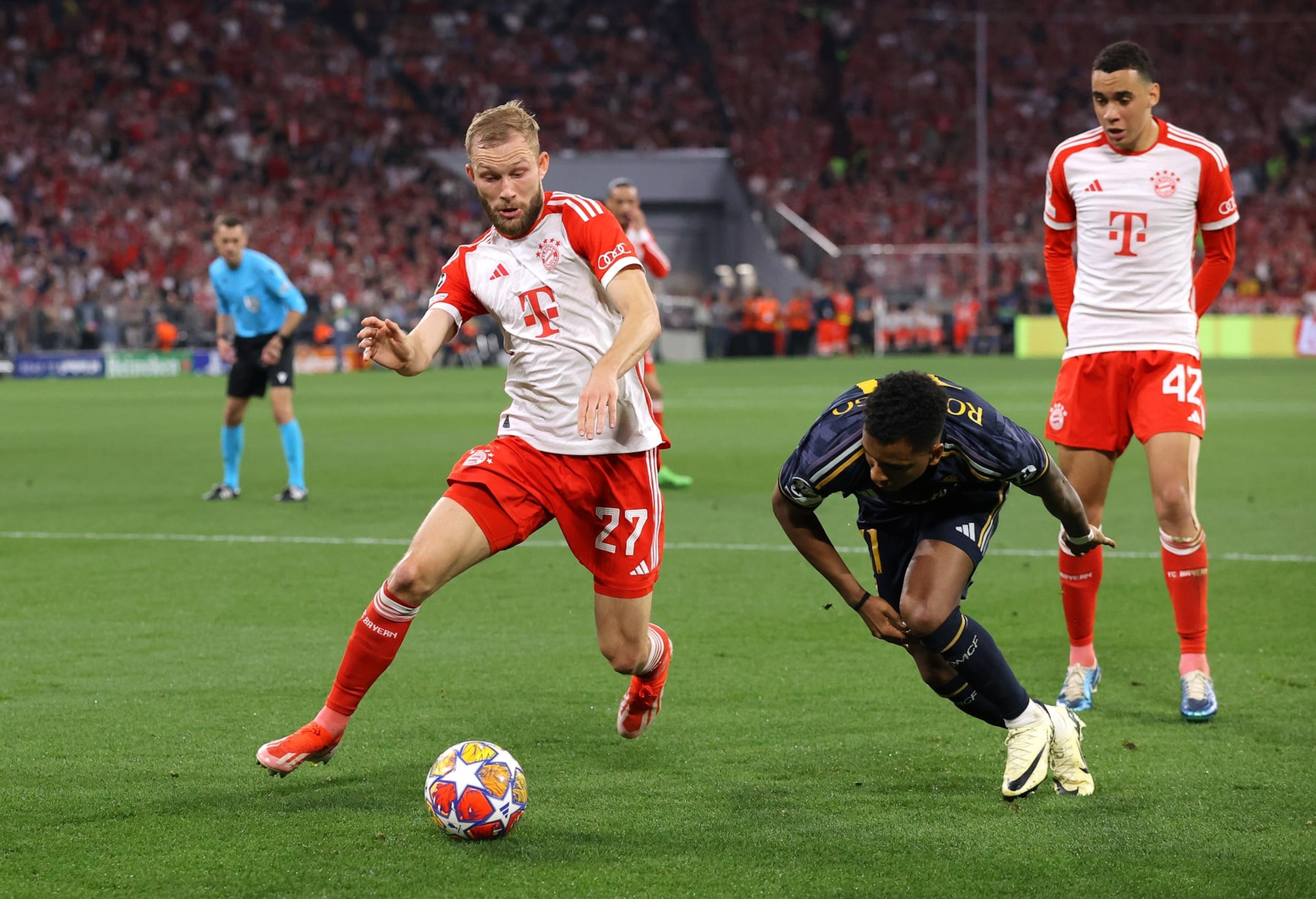 MUNICH, GERMANY - APRIL 30: Konrad Laimer of FC Bayern München challenges Rodrygoof Real Madrid during the UEFA Champions League semi-final first leg match between FC Bayern München and Real Madrid at Allianz Arena on April 30, 2024 in Munich, Germany. (Photo by James Gill - Danehouse/Getty Images) MUNICH, GERMANY - APRIL 30: Konrad Laimer of FC Bayern München challenges Rodrygoof Real Madrid during the UEFA Champions League semi-final first leg match between FC Bayern München and Real Madrid at Allianz Arena on April 30, 2024 in Munich, Germany. (Photo by James Gill - Danehouse/Getty Images)
