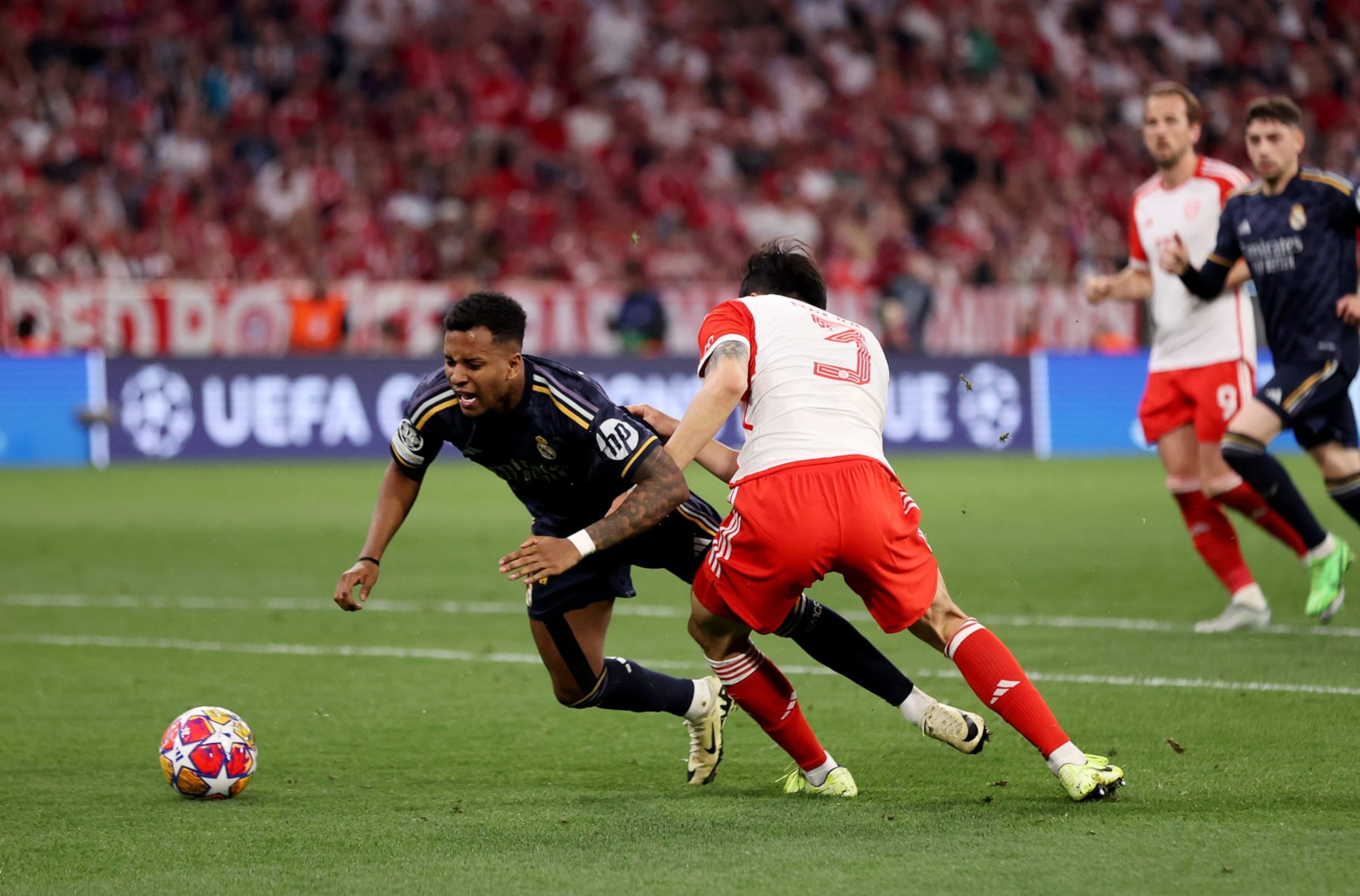 MUNICH, GERMANY - APRIL 30: Rodrygo of Real Madrid is fouled by Kim Min-Jae of Bayern Munich which results in a penalty during the UEFA Champions League semi-final first leg match between FC Bayern München and Real Madrid at Allianz Arena on April 30, 2024 in Munich, Germany. (Photo by Alex Pantling/Getty Images) MUNICH, GERMANY - APRIL 30: Rodrygo of Real Madrid is fouled by Kim Min-Jae of Bayern Munich which results in a penalty during the UEFA Champions League semi-final first leg match between FC Bayern München and Real Madrid at Allianz Arena on April 30, 2024 in Munich, Germany. (Photo by Alex Pantling/Getty Images)