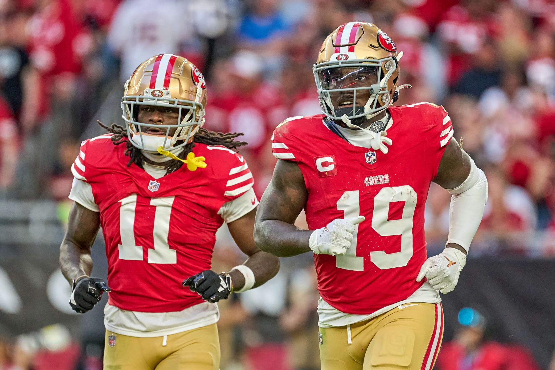 GLENDALE, ARIZONA - DECEMBER 17: Deebo Samuel #19 of the San Francisco 49ers and Brandon Aiyuk #11 of the San Francisco 49ers look on in action during a game between the San Francisco 49ers and the Arizona Cardinals at State Farm Stadium on December 17, 2023 in Glendale, Arizona. (Photo by Robin Alam/ISI Photos/Getty Images)