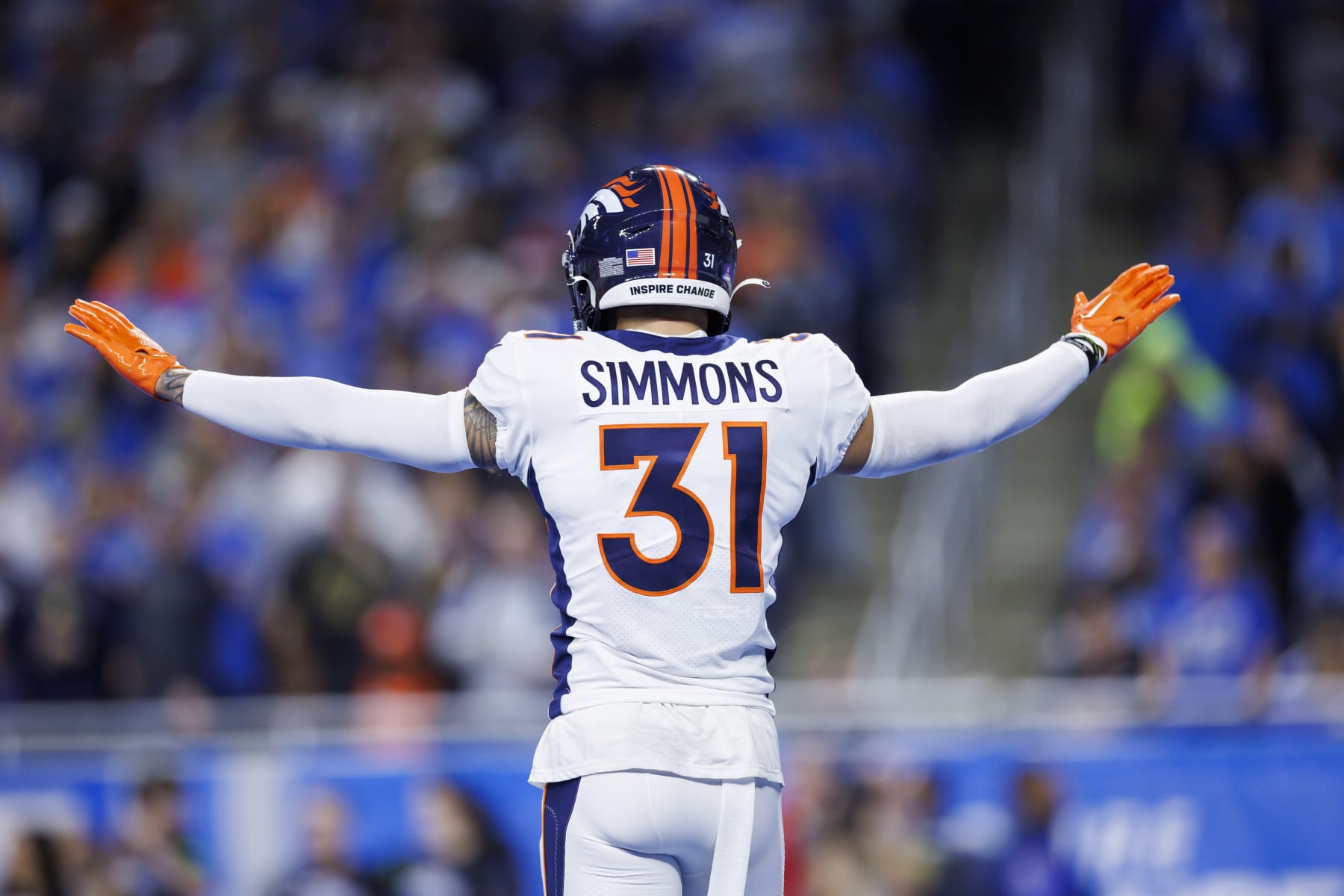 DETROIT, MICHIGAN - DECEMBER 16: Justin Simmons #31 of the Denver Broncos celebrates after a play during an NFL football game against the Detroit Lions at Ford Field on December 16, 2023 in Detroit, Michigan. (Photo by Ryan Kang/Getty Images)
