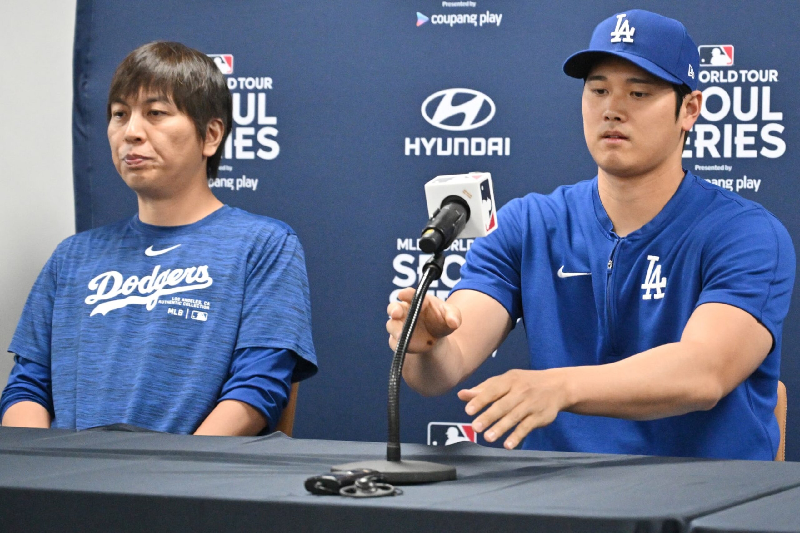 This picture taken on March 16, 2024 shows Los Angeles Dodgers' Shohei Ohtani (R) and his interpreter Ippei Mizuhara (L) attending a press conference at Gocheok Sky Dome in Seoul ahead of the 2024 MLB Seoul Series baseball game between Los Angeles Dodgers and San Diego Padres. The Los Angeles Dodgers said on March 21 they had fired Shohei Ohtani's interpreter after the Japanese baseball star's representatives claimed he had been the victim of "a massive theft" reported to involve millions of dollars. (Photo by Jung Yeon-je / AFP) (Photo by JUNG YEON-JE/AFP via Getty Images)