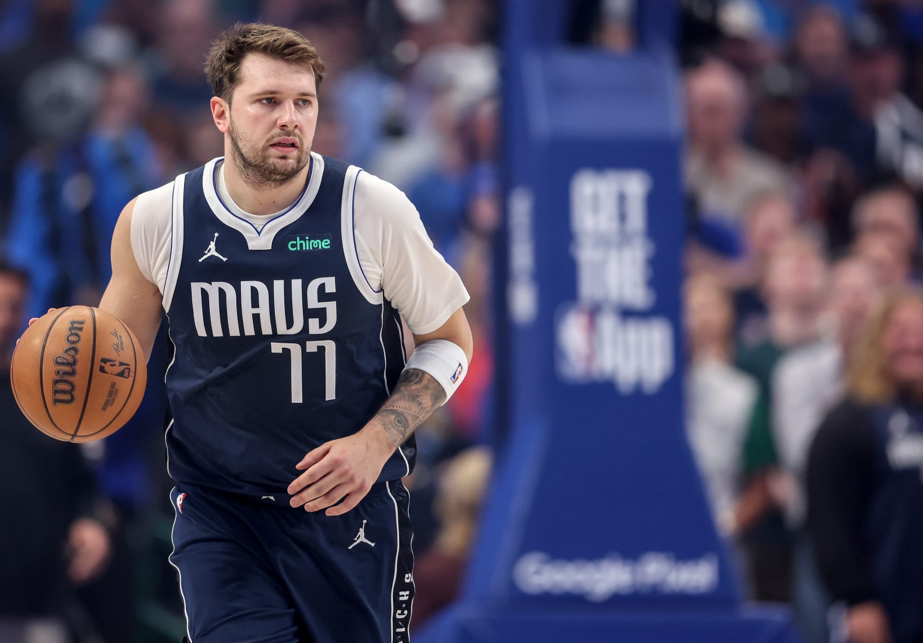 DALLAS, TEXAS - APRIL 28: Luka Doncic #77 of the Dallas Mavericks brings the ball up court against the Los Angeles Clippers in the first half of game four of the Western Conference First Round Playoffs at American Airlines Center on April 28, 2024 in Dallas, Texas.  NOTE TO USER: User expressly acknowledges and agrees that, by downloading and or using this photograph, User is consenting to the terms and conditions of the Getty Images License Agreement. (Photo by Tim Warner/Getty Images)