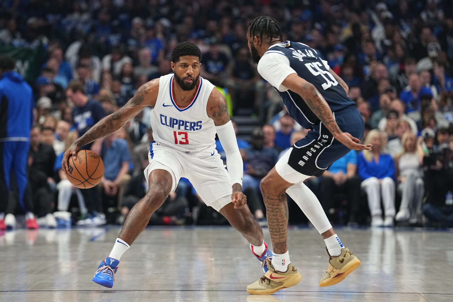 DALLAS, TX - APRIL 26: Paul George #13 of the LA Clippers dribbles the ball during the game against the Dallas Mavericks during Round 1 Game 3 of the 2024 NBA Playoffs on April 26, 2024 at the American Airlines Center in Dallas, Texas. NOTE TO USER: User expressly acknowledges and agrees that, by downloading and or using this photograph, User is consenting to the terms and conditions of the Getty Images License Agreement. Mandatory Copyright Notice: Copyright 2023 NBAE (Photo by Glenn James/NBAE via Getty Images)