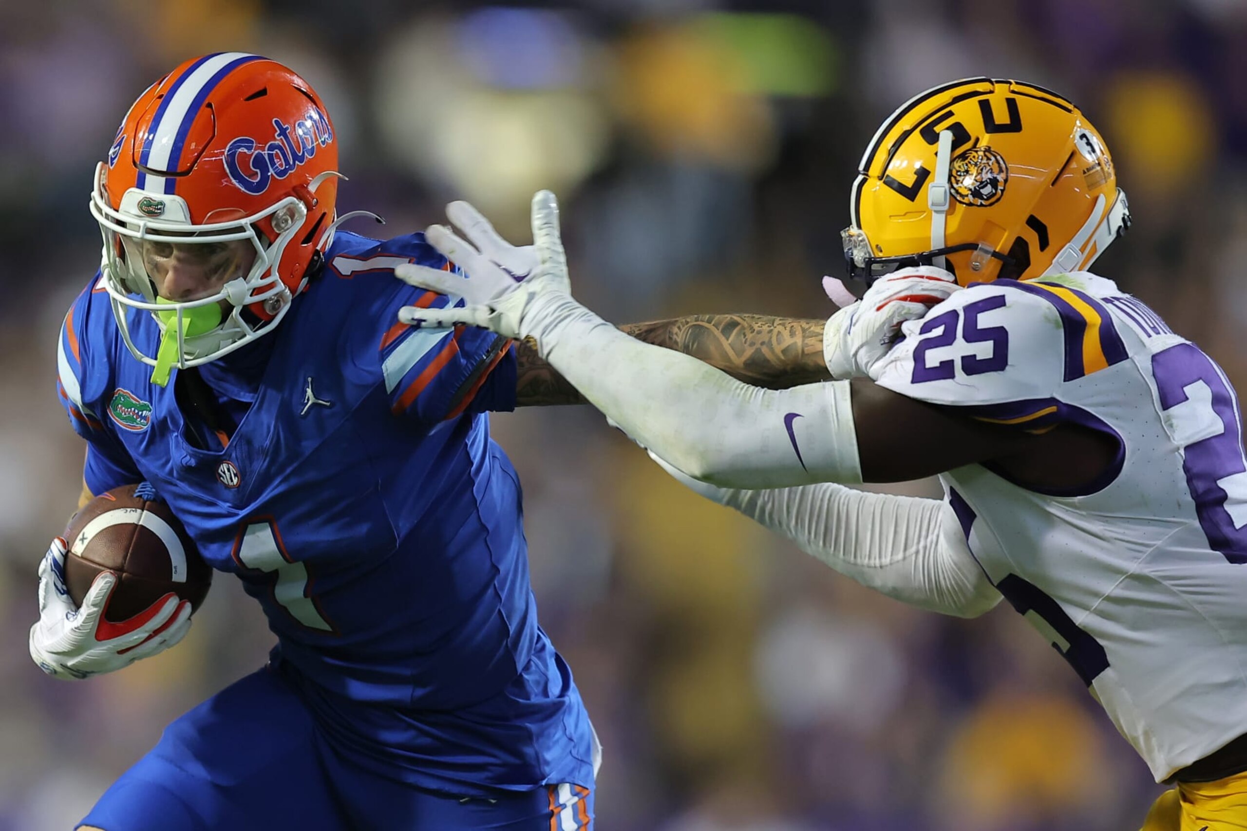BATON ROUGE, LOUISIANA - NOVEMBER 11: Ricky Pearsall #1 of the Florida Gators runs with the ball as Javien Toviano #25 of the LSU Tigers defends during the second half at Tiger Stadium on November 11, 2023 in Baton Rouge, Louisiana. (Photo by Jonathan Bachman/Getty Images)