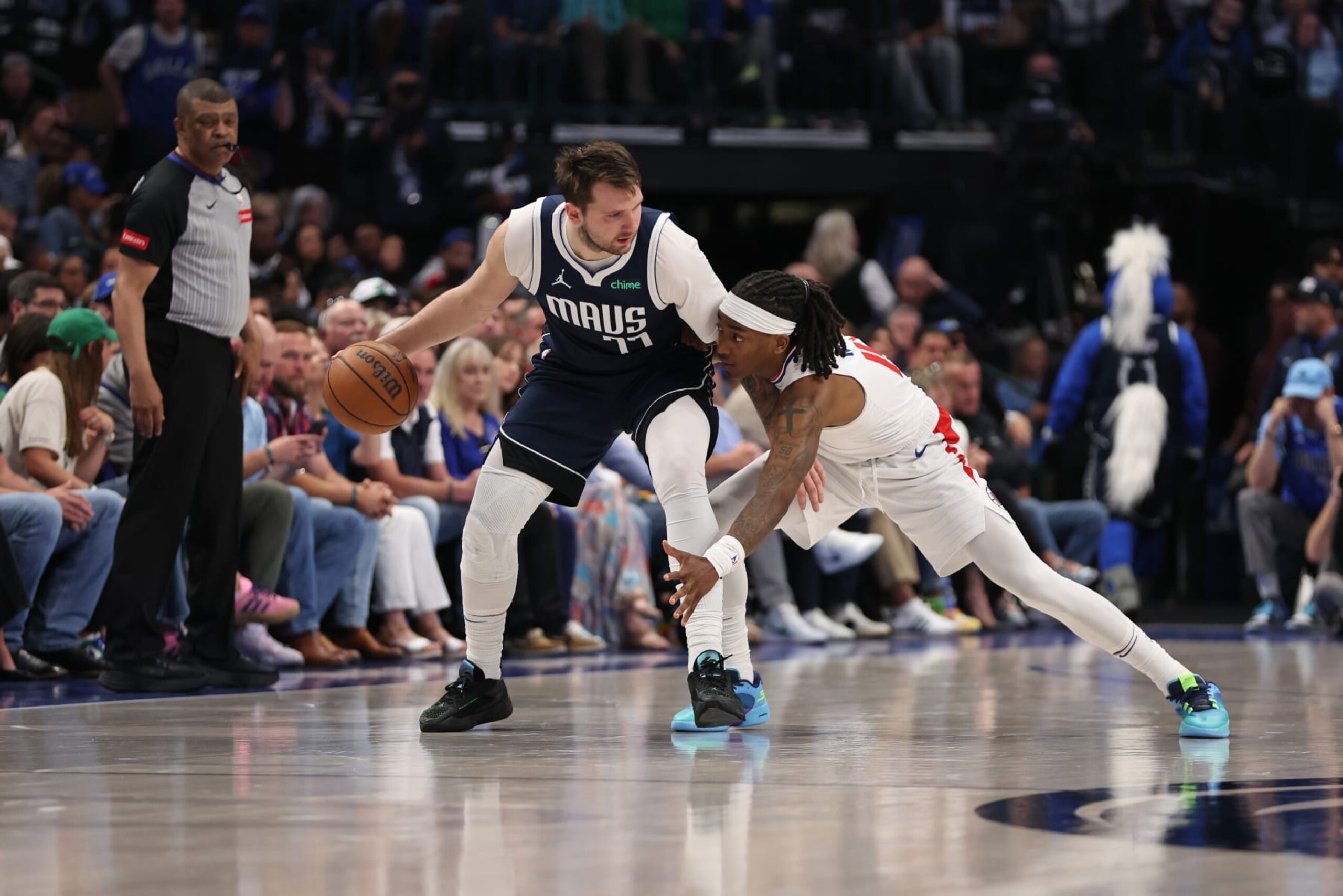 DALLAS, TX - APRIL 28: Luka Doncic #77 of the Dallas Mavericks dribbles the ball during the game against the LA Clippers during Round 1 Game 4 of the 2024 NBA Playoffs on April 28, 2024 at the American Airlines Center in Dallas, Texas. NOTE TO USER: User expressly acknowledges and agrees that, by downloading and or using this photograph, User is consenting to the terms and conditions of the Getty Images License Agreement. Mandatory Copyright Notice: Copyright 2024 NBAE (Photo by Tim Heitman/NBAE via Getty Images) DALLAS, TX - APRIL 28: Luka Doncic #77 of the Dallas Mavericks dribbles the ball during the game against the LA Clippers during Round 1 Game 4 of the 2024 NBA Playoffs on April 28, 2024 at the American Airlines Center in Dallas, Texas. NOTE TO USER: User expressly acknowledges and agrees that, by downloading and or using this photograph, User is consenting to the terms and conditions of the Getty Images License Agreement. Mandatory Copyright Notice: Copyright 2024 NBAE (Photo by Tim Heitman/NBAE via Getty Images)