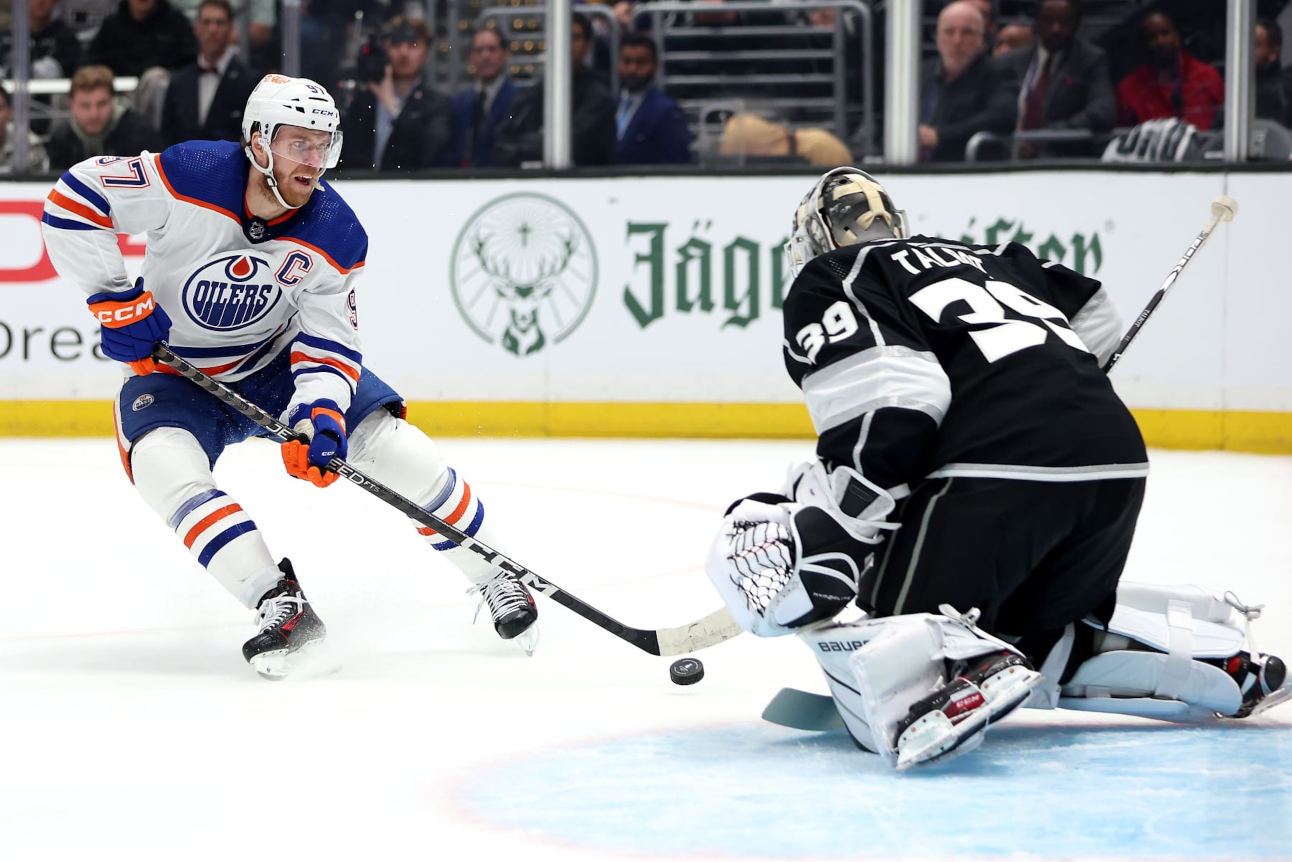 LOS ANGELES, CALIFORNIA - APRIL 26: Connor McDavid #97 of the Edmonton Oilers takes a shot on goal as Cam Talbot #39 of the Los Angeles Kings blocks the shot during the first period of Game Three of the First Round of the 2024 Stanley Cup Playoffs at Crypto.com Arena on April 26, 2024 in Los Angeles, California.  (Photo by Sean M. Haffey/Getty Images)