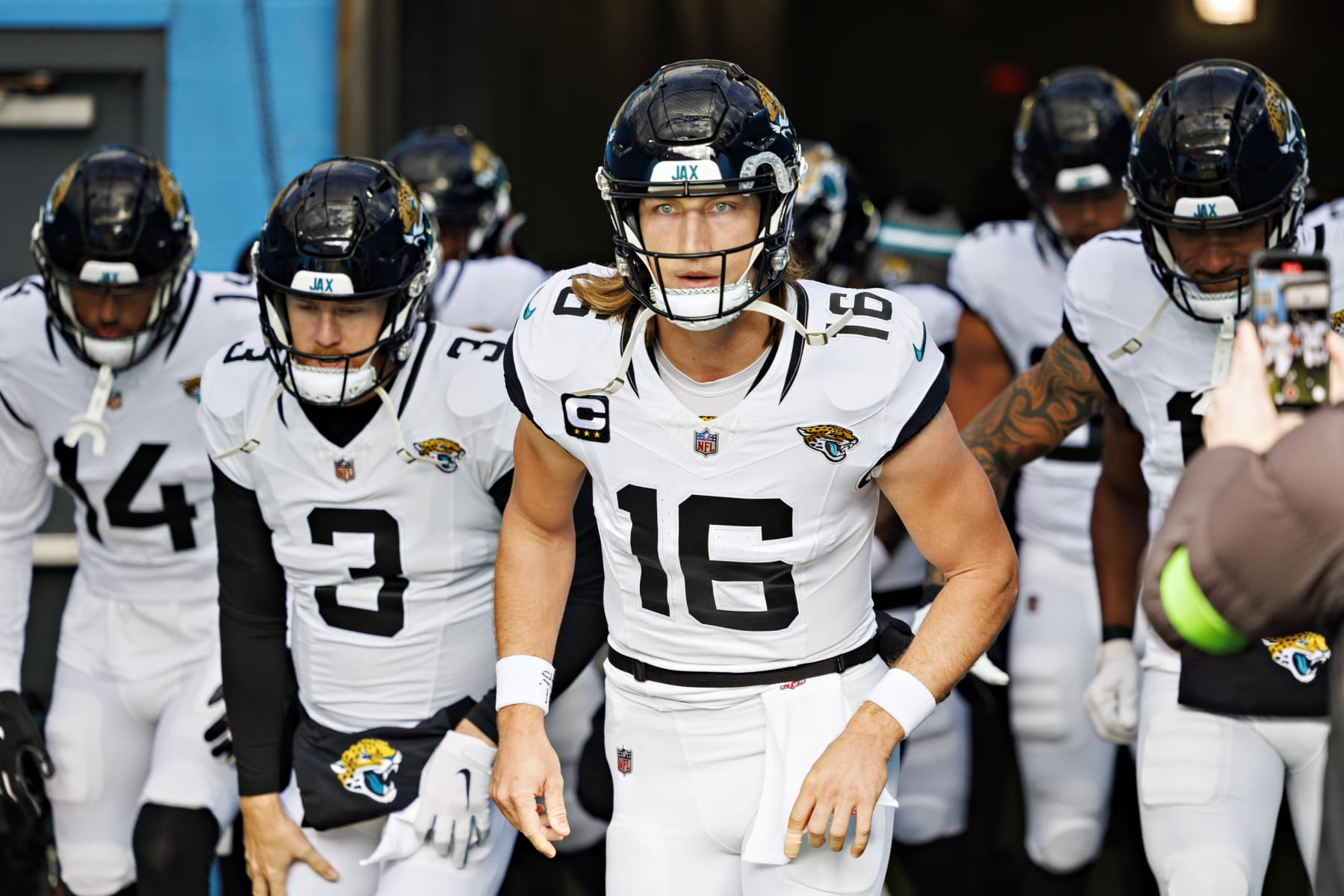 NASHVILLE TENNESSEE - JANUARY 07: Trevor Lawrence #16 and the offense of the Jacksonville Jaguars run onto the field before the game against the Tennessee Titans in Nashville, Tennessee at Nissan Stadium on January 7, 2024 in Houston, Texas. The Titans defeated the Jaguars 28-20.  (Photo by Wesley Hitt/Getty Images)