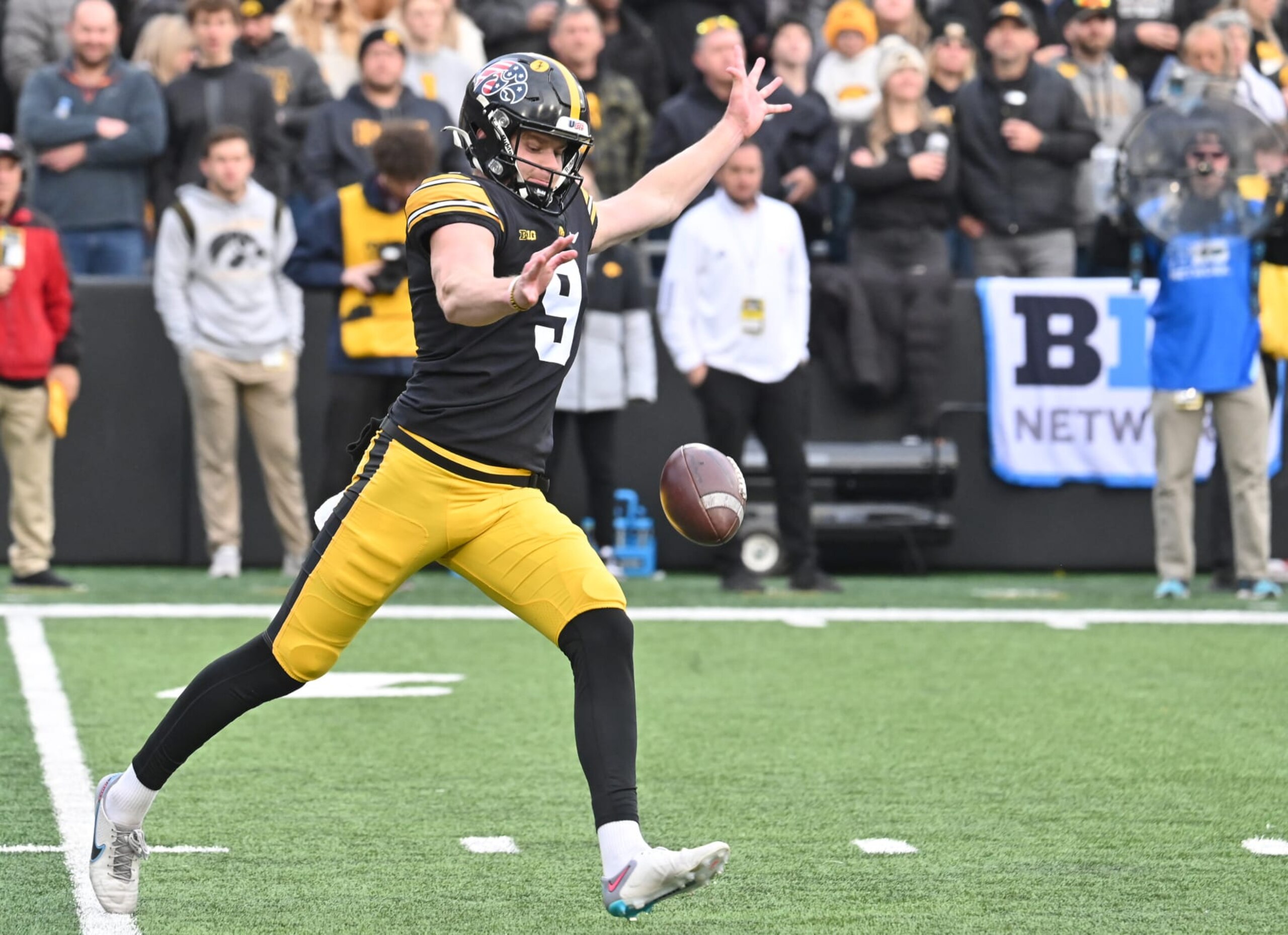 IOWA CITY, IA - NOVEMBER 11: Iowa Hawkeyes punter Tory Taylor (9) punts during a college football game between the Rutgers Scarlet Knights and the Iowa Hawkeyes on November 11, 2023, at Kinnick Stadium in Iowa City, IA. (Photo by Keith Gillett/Icon Sportswire via Getty Images)