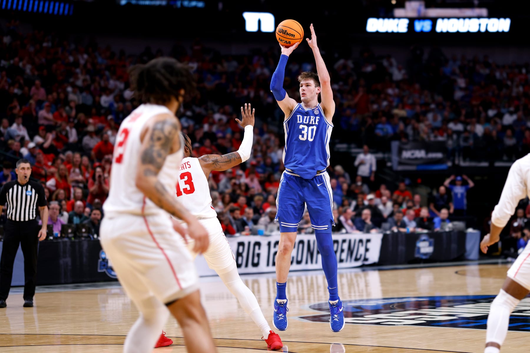 DALLAS, TEXAS - MARCH 29: Kyle Filipowski #30 of the Duke Blue Devils puts up a three-point shot against the Houston Cougars during the second half in the Sweet Sixteen round of the NCAA Men's Basketball Tournament at American Airlines Center on March 29, 2024 in Dallas, Texas. (Photo by Lance King/Getty Images)