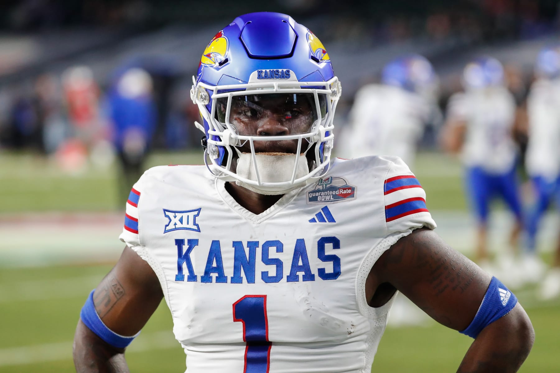 PHOENIX, AZ - DECEMBER 26:  Kansas Jayhawks safety Kenny Logan Jr. (1) looks on before the Guaranteed Rate Bowl college football game between the Kansas Jayhawks  and the UNLV Rebels on December 26, 2023 at Chase Field in Phoenix, Arizona. (Photo by Kevin Abele/Icon Sportswire via Getty Images)