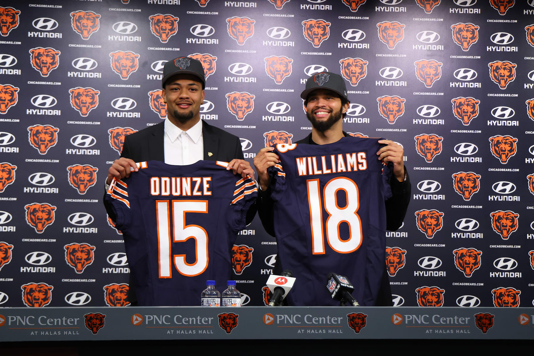 LAKE FOREST, ILLINOIS - APRIL 26: Rome Odunze #15 and Caleb Williams #18 of the Chicago Bears pose for a photo during their introductory press conference at Halas Hall on April 26, 2024 in Lake Forest, Illinois. Caleb Williams was selected first overall and Rome Odunze was selected ninth overall in the first round of the 2024 NFL Draft Thursday. (Photo by Michael Reaves/Getty Images)
