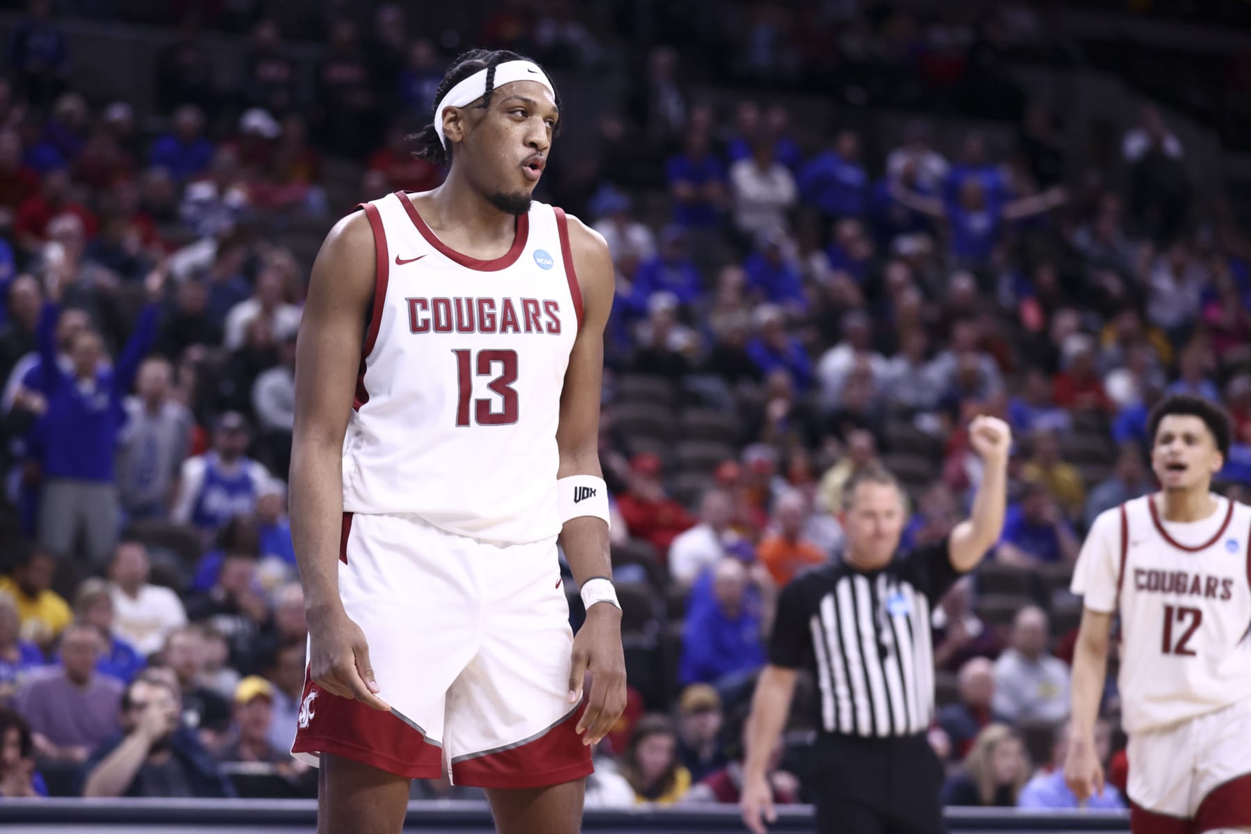 OMAHA, NEBRASKA - MARCH 21: Isaac Jones #13 of the Washington State Cougars reacts during the game against the Drake Bulldogs in first round of the 2024 NCAA Men's Basketball Tournament held at CHI Health Center on March 21, 2024 in Omaha, Nebraska. (Photo by Tyler Schank/NCAA Photos via Getty Images)