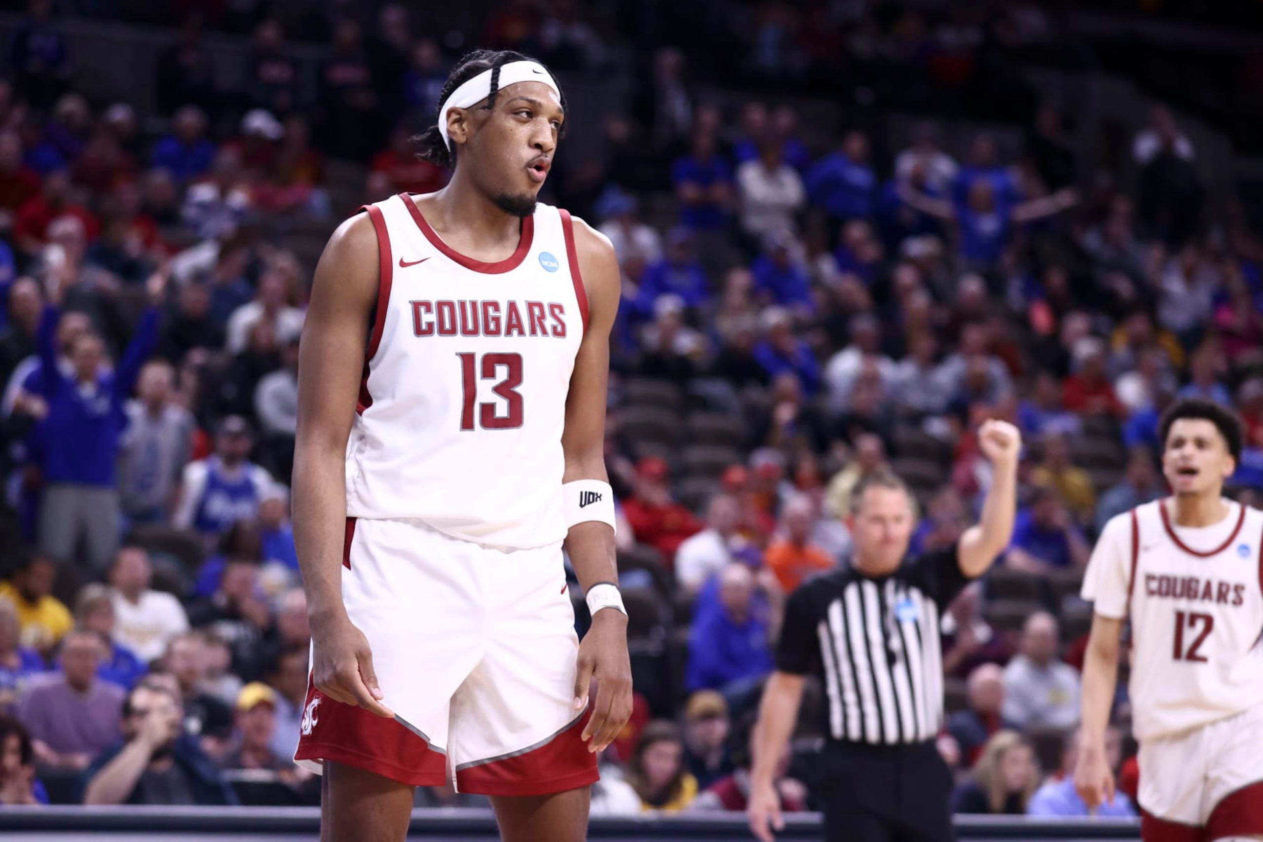OMAHA, NEBRASKA - MARCH 21: Isaac Jones #13 of the Washington State Cougars reacts during the game against the Drake Bulldogs in first round of the 2024 NCAA Men's Basketball Tournament held at CHI Health Center on March 21, 2024 in Omaha, Nebraska. (Photo by Tyler Schank/NCAA Photos via Getty Images)