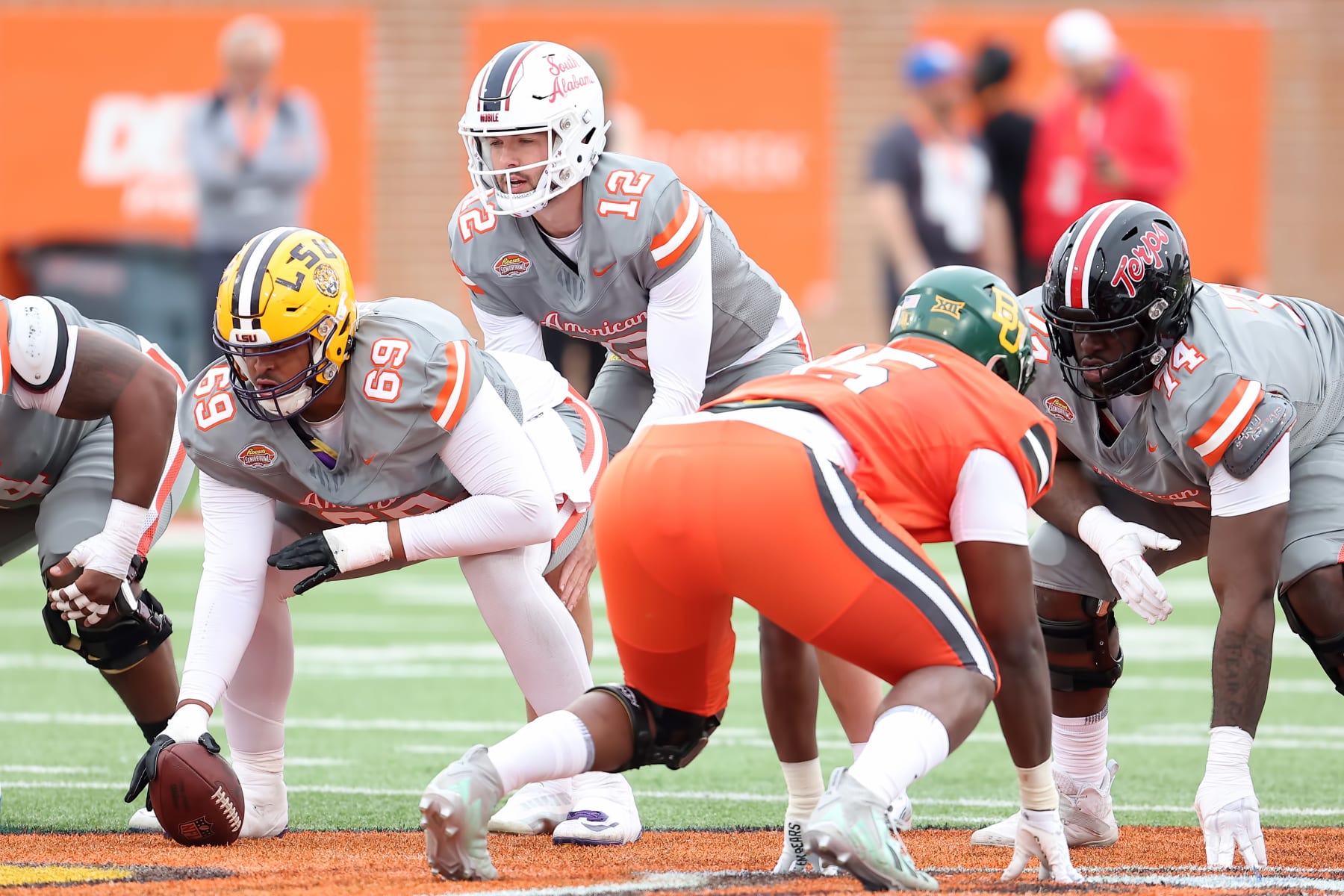 MOBILE, AL - FEBRUARY 03: American quarterback Carter Bradley of South Alabama (12) takes a snap from American offensive lineman Charles Turner III of LSU (69) during the 2024 Reese's Senior Bowl on February 3, 2024 at Hancock Whitney Stadium in Mobile, Alabama.  (Photo by Michael Wade/Icon Sportswire via Getty Images)