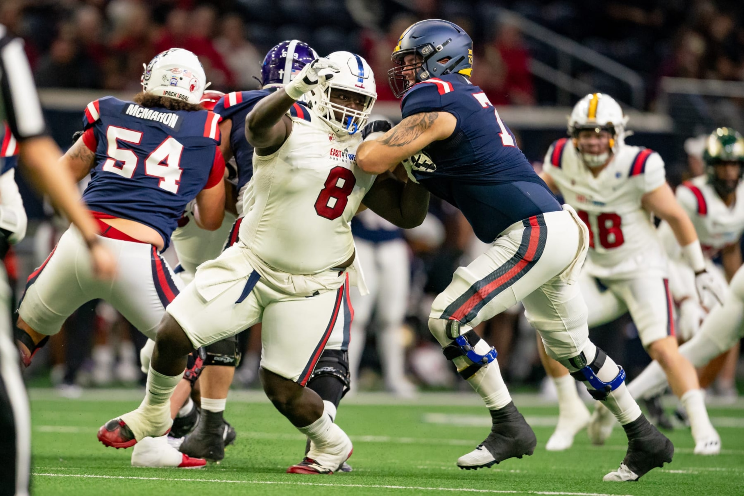 FRISCO, TX - FEBRUARY 01: East Team defensive lineman Evan Anderson (8) of  Florida Atlantic is blocked by West Team offensive guard Doug Nester (78) during the East-West Shrine Bowl game on February 1, 2024 at the Ford Center at the star in Frisco, TX. (Photo by Chris Leduc/Icon Sportswire via Getty Images)