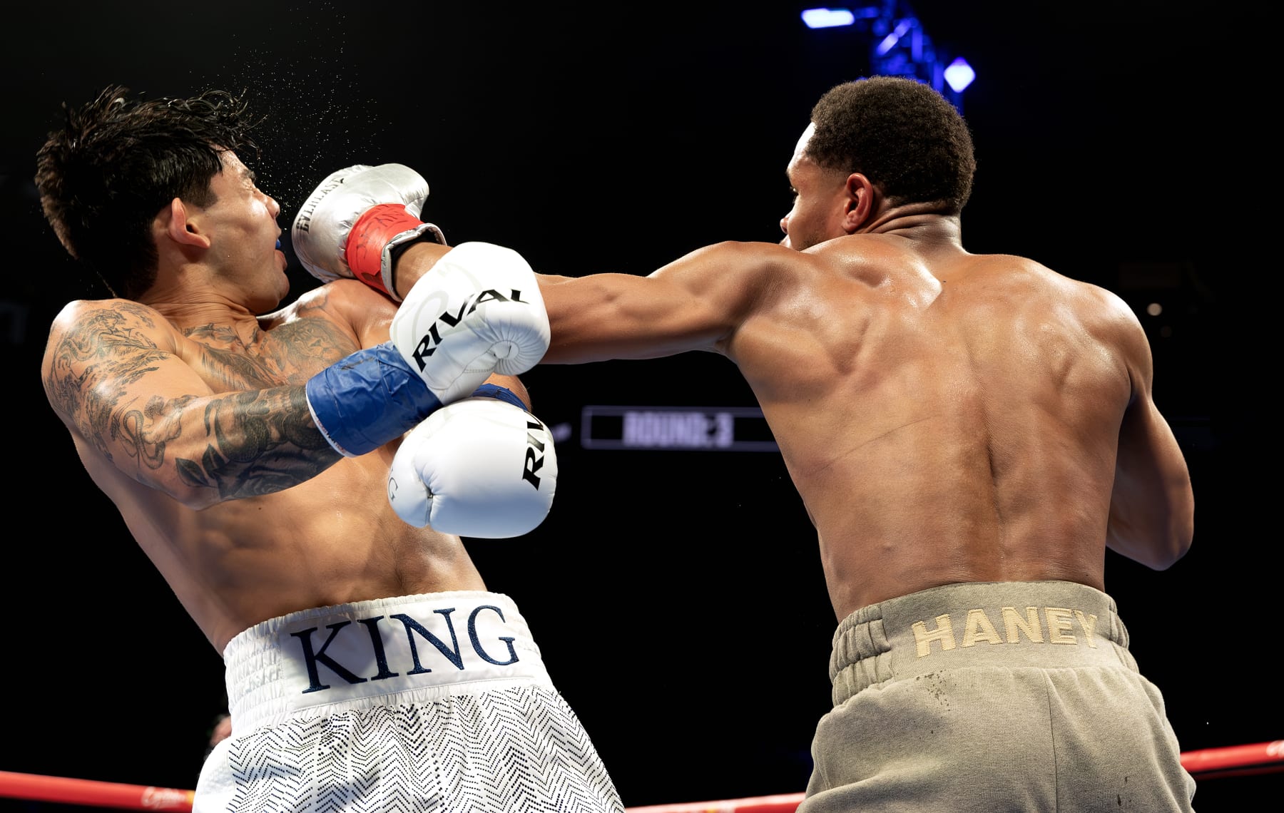 NEW YORK, NEW YORK - APRIL 20:  Devin Haney (gray trunks) punches Ryan Garcia (white trunks) during their WBC Super Lightweight title bout at Barclays Center on April 20, 2024 in New York City.  (Photo by Al Bello/Getty Images)