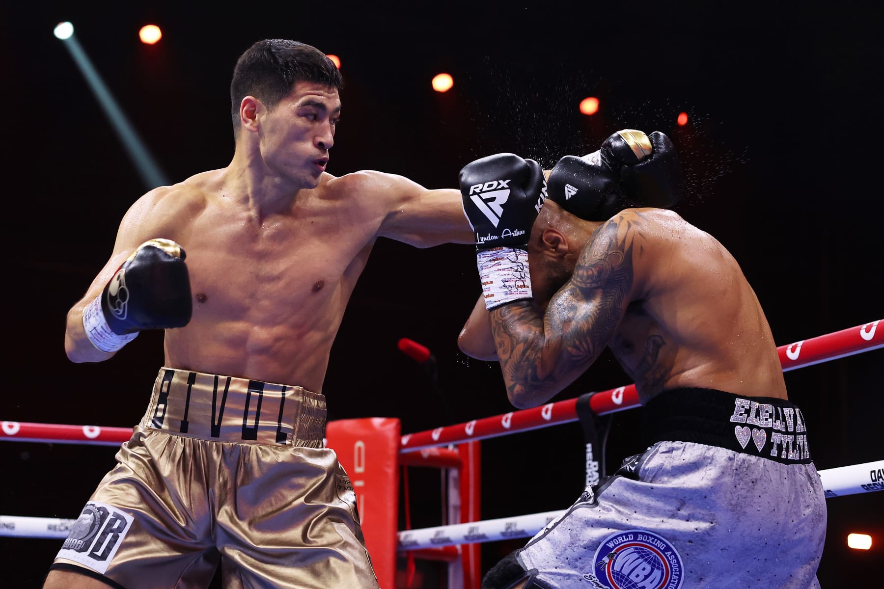 RIYADH, SAUDI ARABIA - DECEMBER 23: Dmitry Bivol punches Lyndon Arthur during the IBO and WBA Super World Light Heavyweight title fight between Dmitry Bivol and Lyndon Arthur during the Day of Reckoning: Fight Night at Kingdom Arena on December 23, 2023 in Riyadh, Saudi Arabia. (Photo by Richard Pelham/Getty Images)