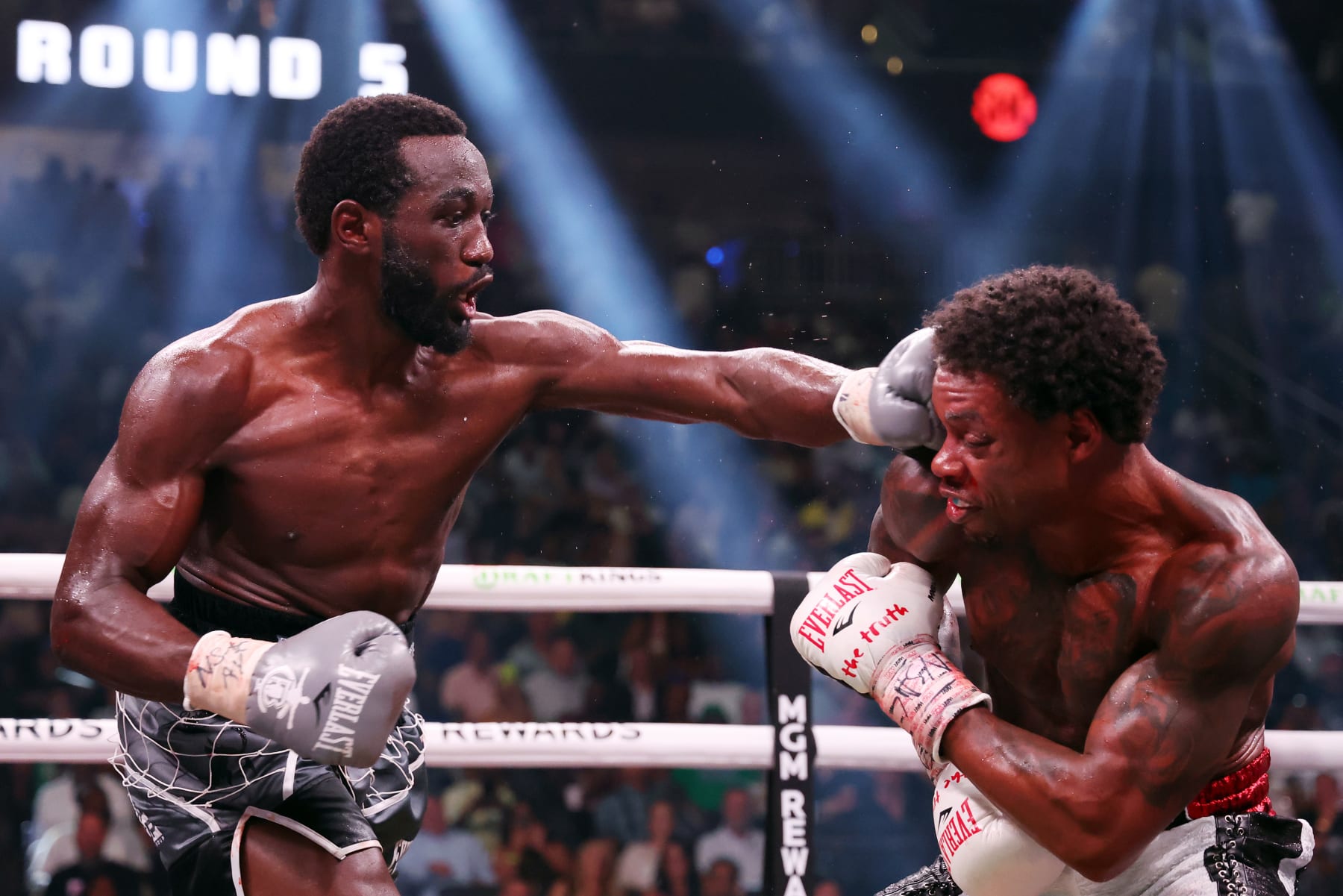 LAS VEGAS, NEVADA - JULY 29: Terence Crawford punches Errol Spence Jr. during round 5 of the World Welterweight Championship bout at T-Mobile Arena on July 29, 2023 in Las Vegas, Nevada. (Photo by Al Bello/Getty Images)