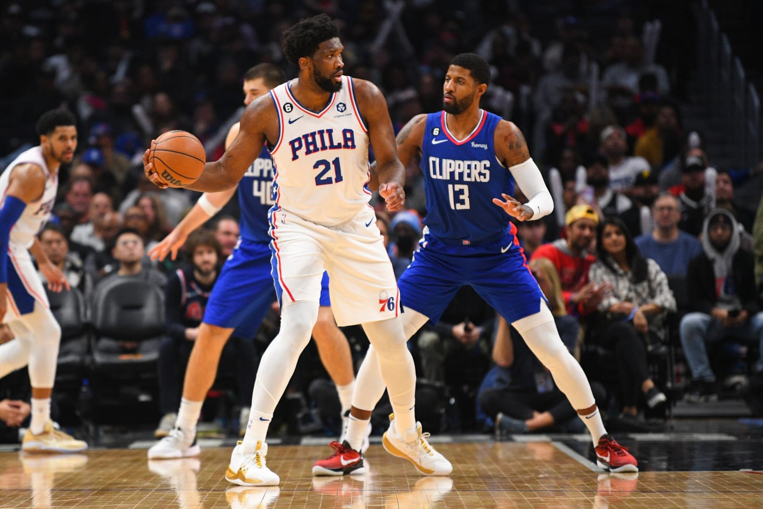 LOS ANGELES, CA - JANUARY 17: Philadelphia 76ers Center Joel Embiid (21) is guarded by Los Angeles Clippers Forward Paul George (13) during a NBA game between the Philadelphia 76ers and the Los Angeles Clippers on January 17, 2023 at Crypto.com Arena in Los Angeles, CA. (Photo by Brian Rothmuller/Icon Sportswire via Getty Images) LOS ANGELES, CA - JANUARY 17: Philadelphia 76ers Center Joel Embiid (21) is guarded by Los Angeles Clippers Forward Paul George (13) during a NBA game between the Philadelphia 76ers and the Los Angeles Clippers on January 17, 2023 at Crypto.com Arena in Los Angeles, CA. (Photo by Brian Rothmuller/Icon Sportswire via Getty Images)
