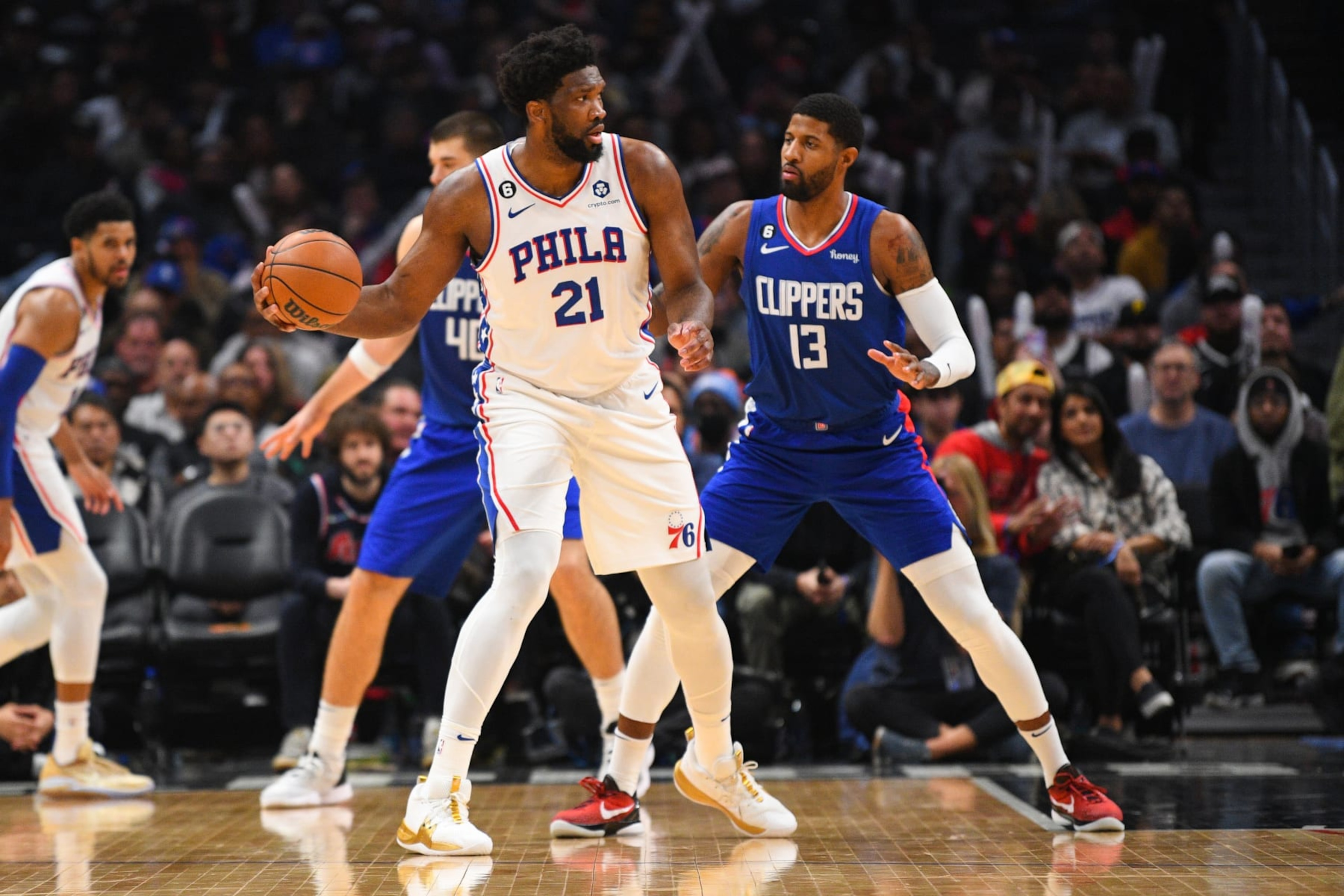 LOS ANGELES, CA - JANUARY 17: Philadelphia 76ers Center Joel Embiid (21) is guarded by Los Angeles Clippers Forward Paul George (13) during a NBA game between the Philadelphia 76ers and the Los Angeles Clippers on January 17, 2023 at Crypto.com Arena in Los Angeles, CA. (Photo by Brian Rothmuller/Icon Sportswire via Getty Images) LOS ANGELES, CA - JANUARY 17: Philadelphia 76ers Center Joel Embiid (21) is guarded by Los Angeles Clippers Forward Paul George (13) during a NBA game between the Philadelphia 76ers and the Los Angeles Clippers on January 17, 2023 at Crypto.com Arena in Los Angeles, CA. (Photo by Brian Rothmuller/Icon Sportswire via Getty Images)