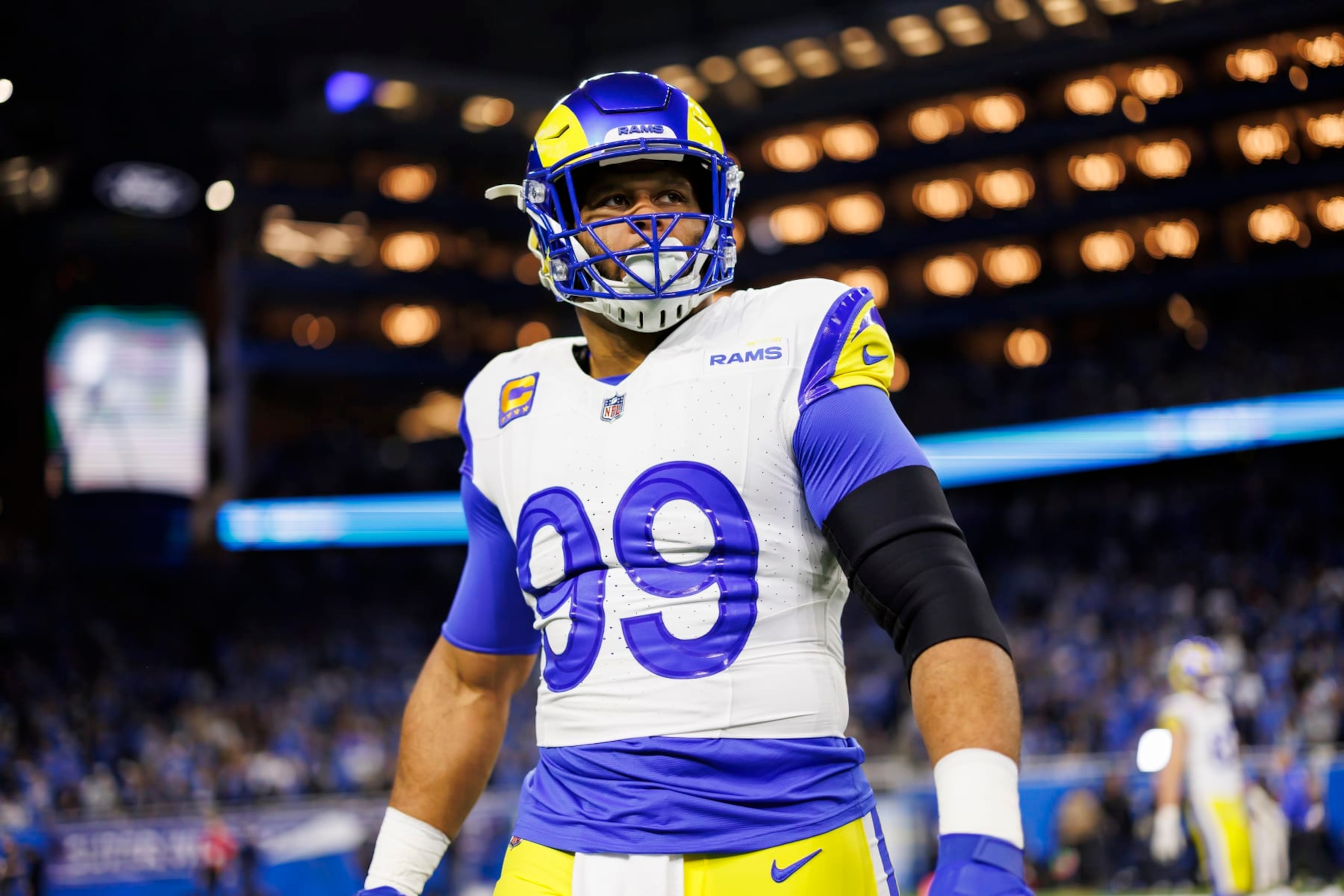 DETROIT, MICHIGAN - JANUARY 14: Aaron Donald #99 of the Los Angeles Rams looks on during pregame warmups prior to an NFC Wild Card Playoff football game against the Detroit Lions at Ford Field on January 14, 2024 in Detroit, Michigan. (Photo by Ryan Kang/Getty Images) DETROIT, MICHIGAN - JANUARY 14: Aaron Donald #99 of the Los Angeles Rams looks on during pregame warmups prior to an NFC Wild Card Playoff football game against the Detroit Lions at Ford Field on January 14, 2024 in Detroit, Michigan. (Photo by Ryan Kang/Getty Images)