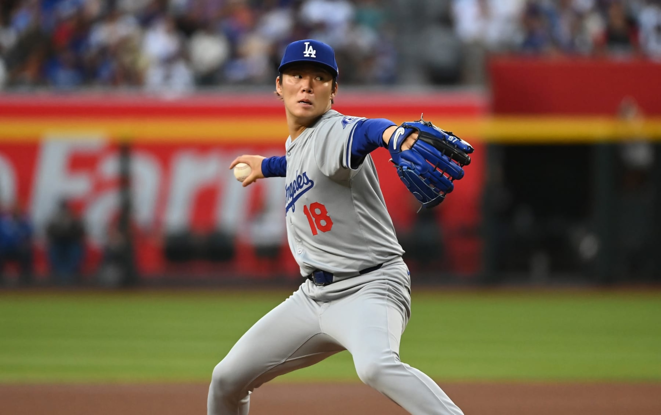 PHOENIX, ARIZONA - MAY 01: Yoshinobu Yamamoto #18 of the Los Angeles Dodgers delivers a first inning pitch against the Arizona Diamondbacks at Chase Field on May 01, 2024 in Phoenix, Arizona. Dodgers won 8-0. (Photo by Norm Hall/Getty Images)