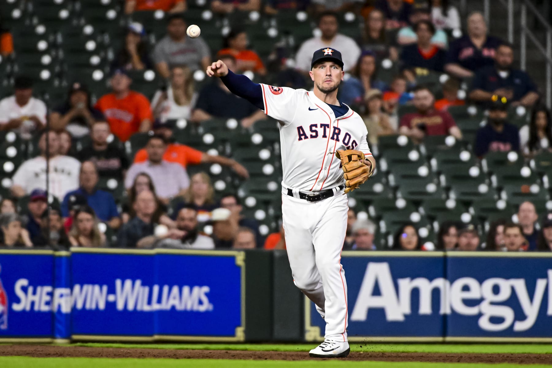 HOUSTON, TEXAS - MAY 01: Alex Bregman #2 of the Houston Astros throws after fielding a ball in the fifth inning against the Cleveland Guardians  at Minute Maid Park on May 01, 2024 in Houston, Texas. (Photo by Logan Riely/Getty Images)