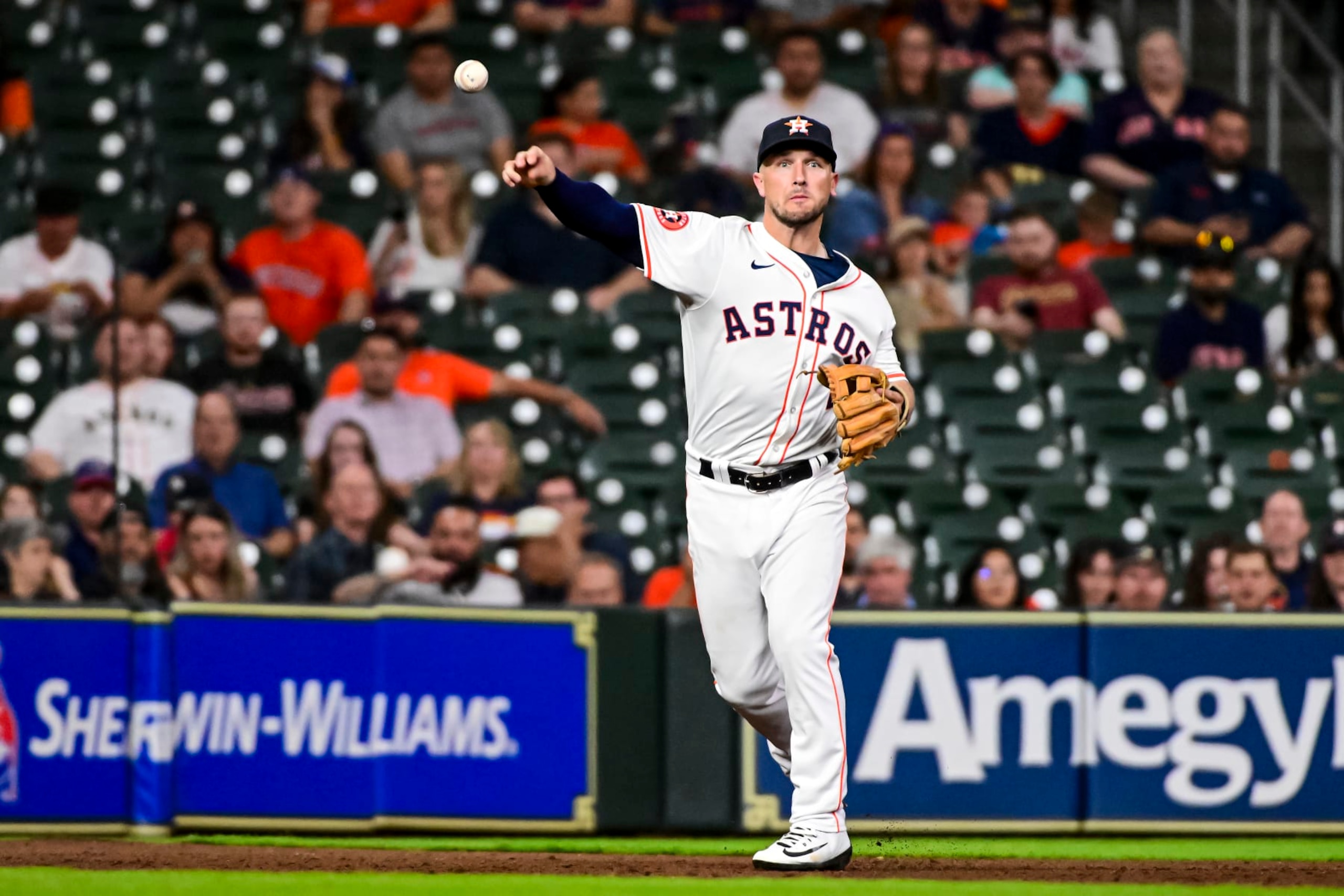 HOUSTON, TEXAS - MAY 01: Alex Bregman #2 of the Houston Astros throws after fielding a ball in the fifth inning against the Cleveland Guardians  at Minute Maid Park on May 01, 2024 in Houston, Texas. (Photo by Logan Riely/Getty Images)