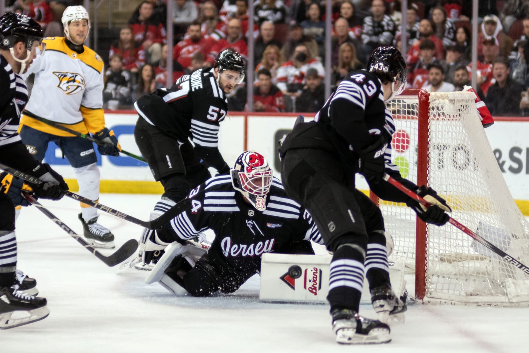 NEWARK, NEW JERSEY - APRIL 07: Jake Allen #34 of the New Jersey Devils makes a second period save during a game against the Nashville Predators at Prudential Center on April 07, 2024 in Newark, New Jersey. (Photo by Michael Mooney/NHLI via Getty Images)