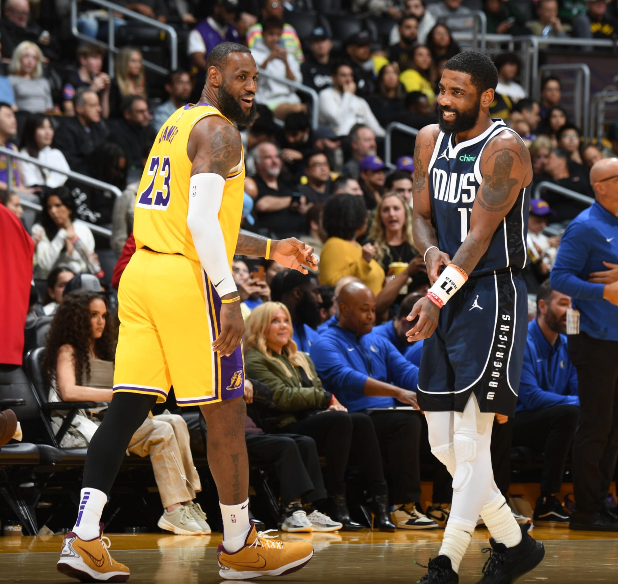 LOS ANGELES, CA - JANUARY 17:  LeBron James #23 of the Los Angeles Lakers & Kyrie Irving #11 of the Dallas Mavericks look on during the game on January 17, 2024 at Crypto.Com Arena in Los Angeles, California. NOTE TO USER: User expressly acknowledges and agrees that, by downloading and/or using this Photograph, user is consenting to the terms and conditions of the Getty Images License Agreement. Mandatory Copyright Notice: Copyright 2024 NBAE (Photo by Andrew D. Bernstein/NBAE via Getty Images)