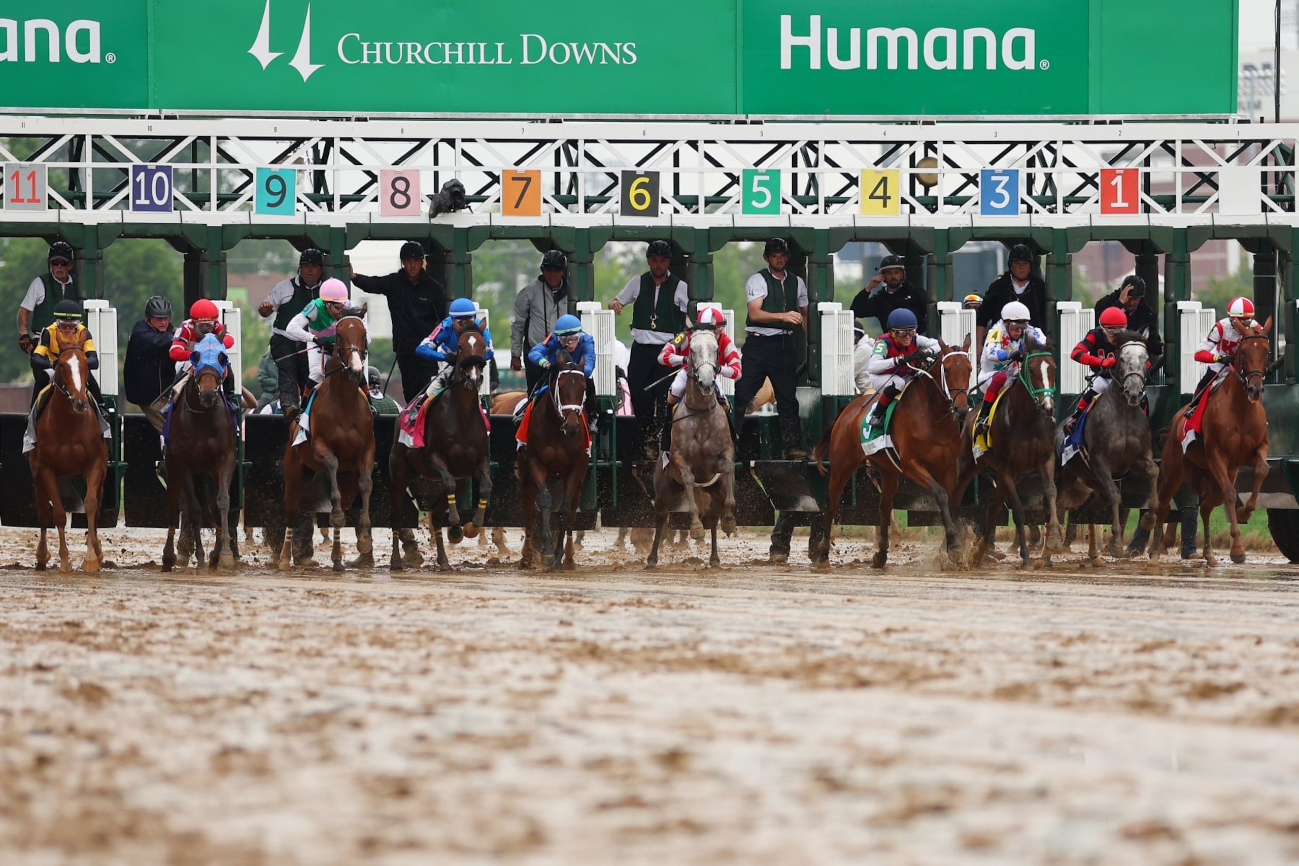 Horses break from the gate during a undercard race at Churchill Downs. Horses break from the gate during a undercard race at Churchill Downs.