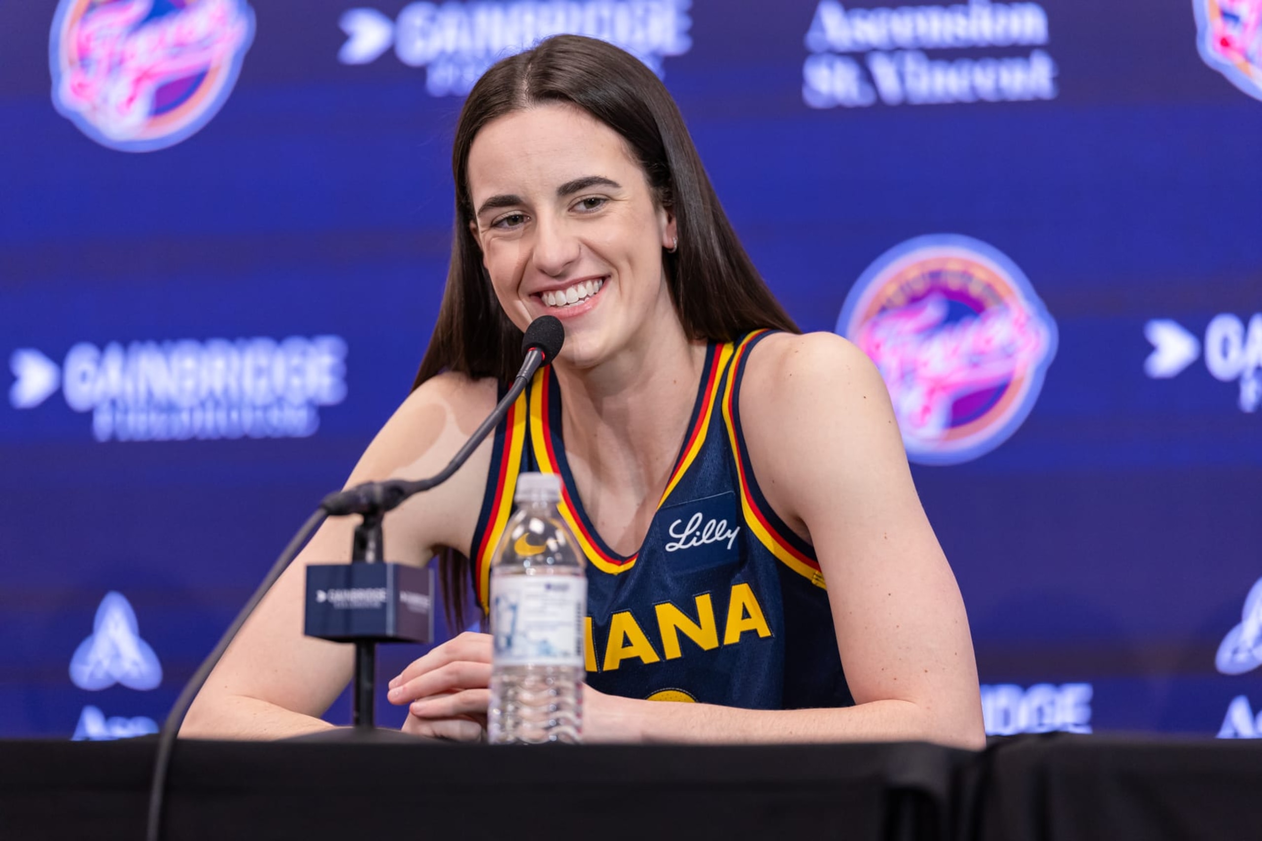INDIANAPOLIS, INDIANA - MAY 1: Caitlin Clark #22 of the Indiana Fever talks to reporters during media day activities  at Gainbridge Fieldhouse on May 1, 2024 in Indianapolis, Indiana. NOTE TO USER: User expressly acknowledges and agrees that, by downloading and or using this photograph, User is consenting to the terms and conditions of the Getty Images License Agreement.  (Photo by Michael Hickey/Getty Images)