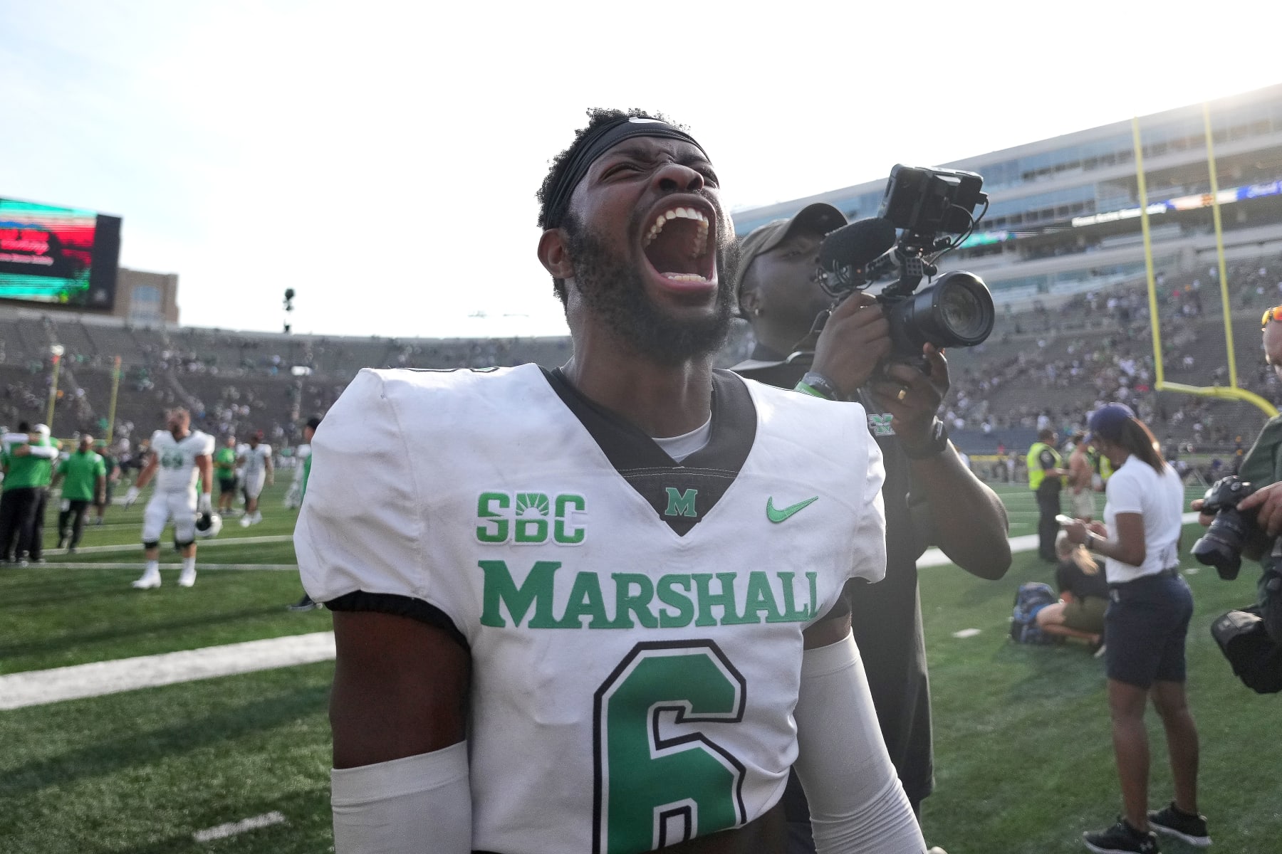SOUTH BEND, IN - SEPTEMBER 10: Marshall Thundering Herd defensive back Micah Abraham (6) celebrates with fans after a game between the Marshall Thundering Herd and the Notre Dame Fighting Irish on September 10, 2022 at Notre Dame Stadium in South Bend, IN. (Photo by Robin Alam/Icon Sportswire via Getty Images)