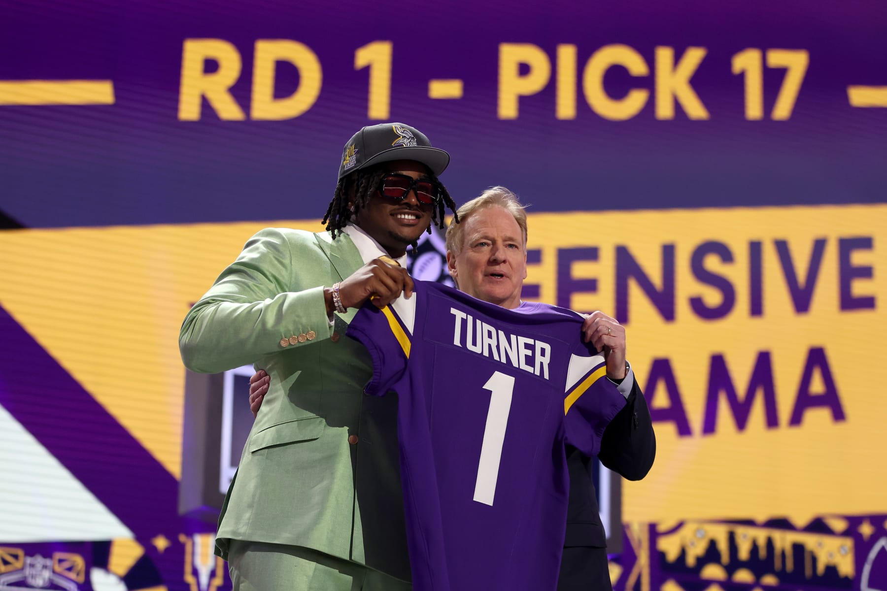 DETROIT, MICHIGAN - APRIL 25: (L-R) Dallas Turner poses with NFL Commissioner Roger Goodell after being selected 17th overall by the Minnesota Vikings during the first round of the 2024 NFL Draft at Campus Martius Park and Hart Plaza on April 25, 2024 in Detroit, Michigan. (Photo by Gregory Shamus/Getty Images)
