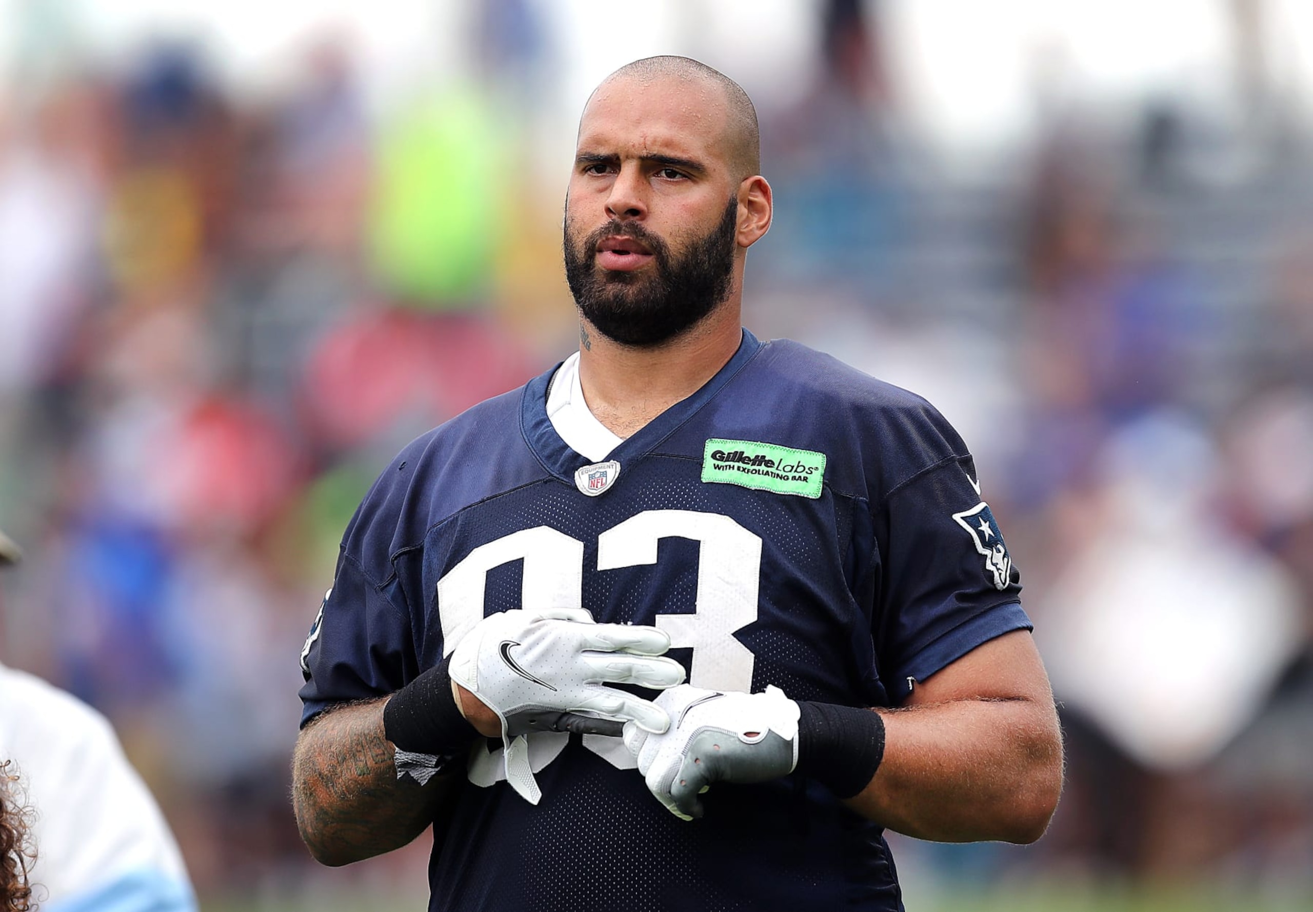 Foxborough, MA - July 27: New England Patriots DL Lawrence Guy Sr. takes off his gloves at the end of practice. (Photo by John Tlumacki/The Boston Globe via Getty Images)